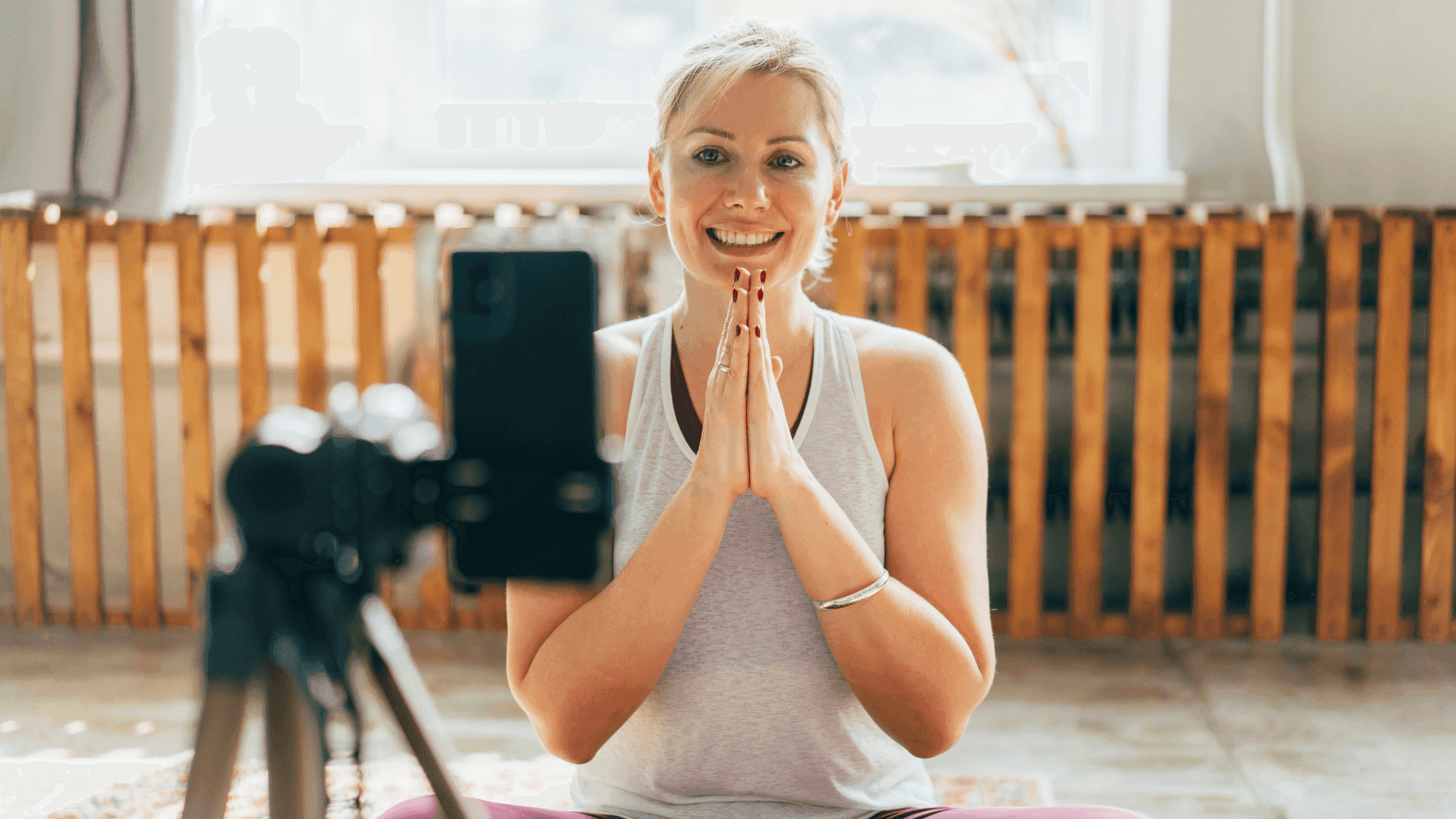 A new yoga teacher welcoming students to her online yoga class.