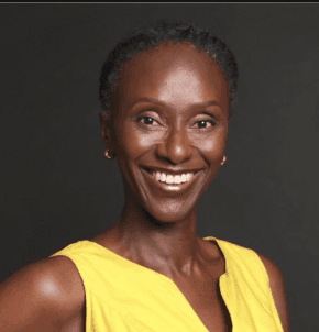 smiling woman wearing white and black pinstriped collared top