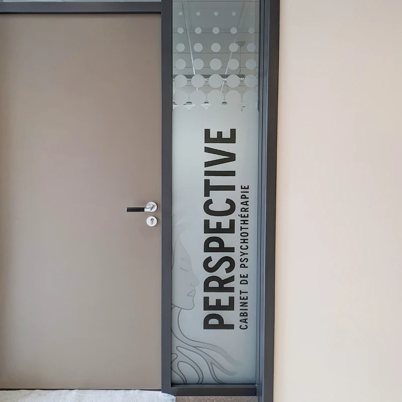 Office door with 'PERSPECTIVE' frosted vinyl