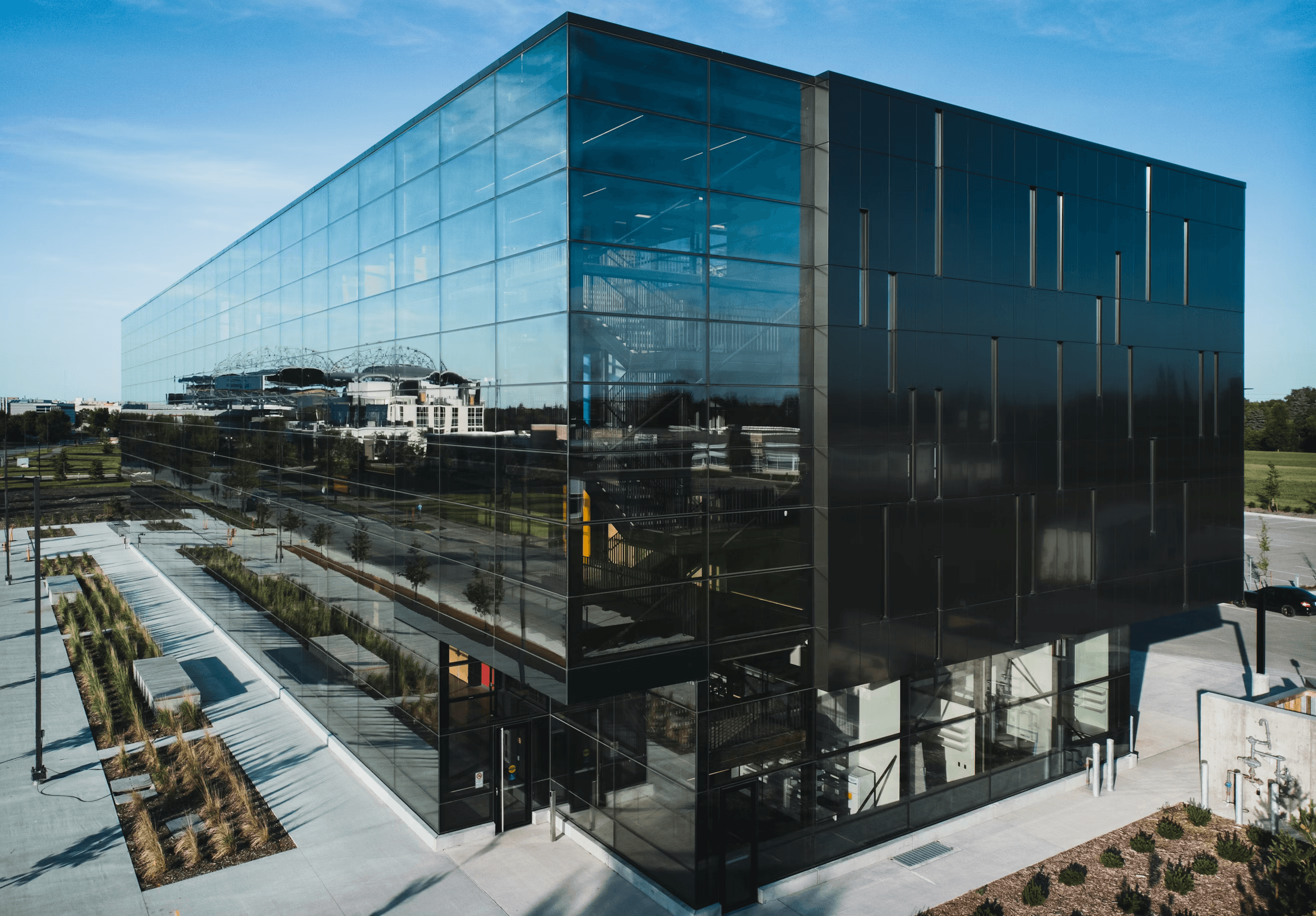 Modern glass office building with reflective facade