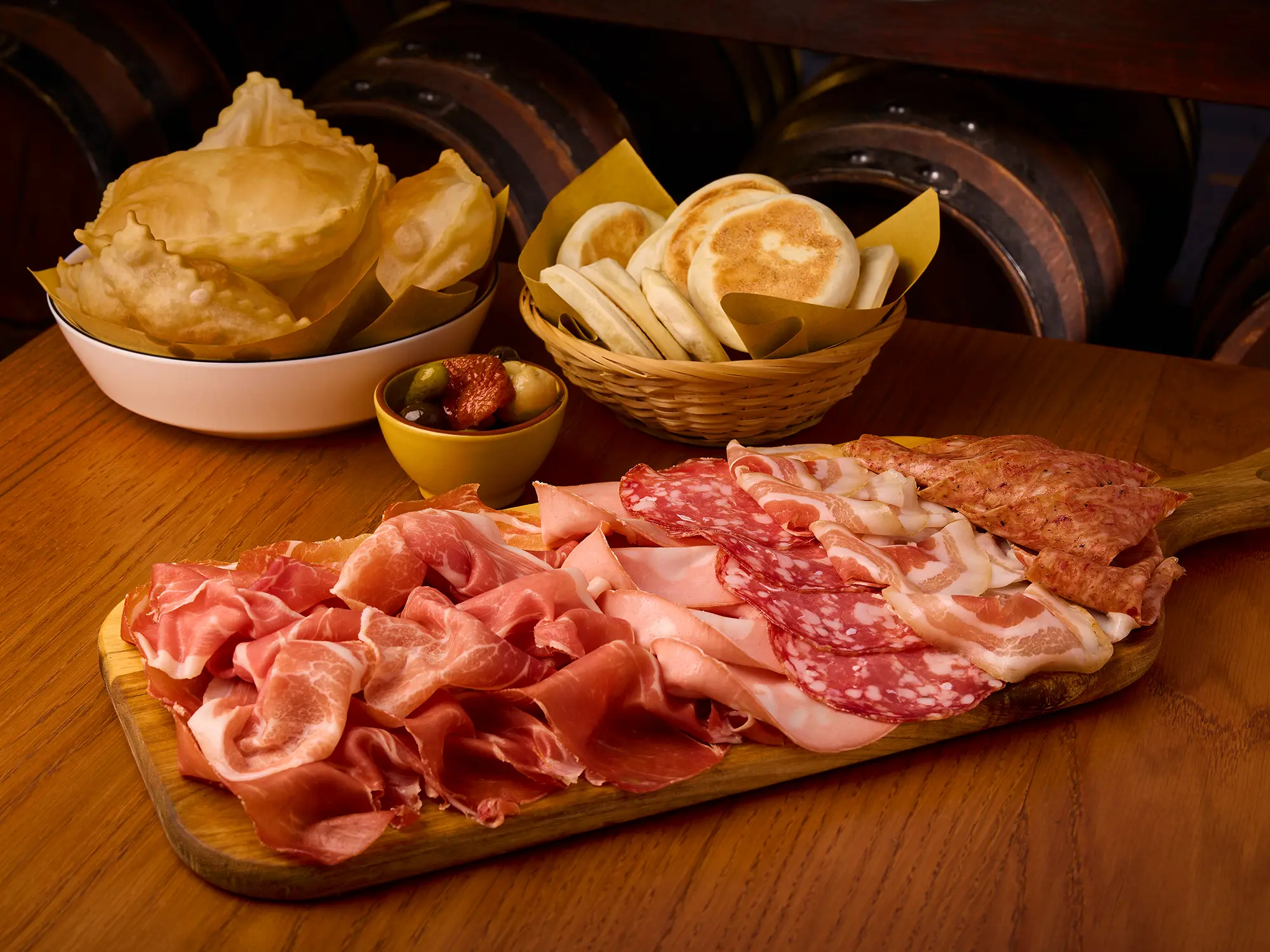 Gnocco fritto and tigelle with cured meats at Enoteca Al Duomo in Modena