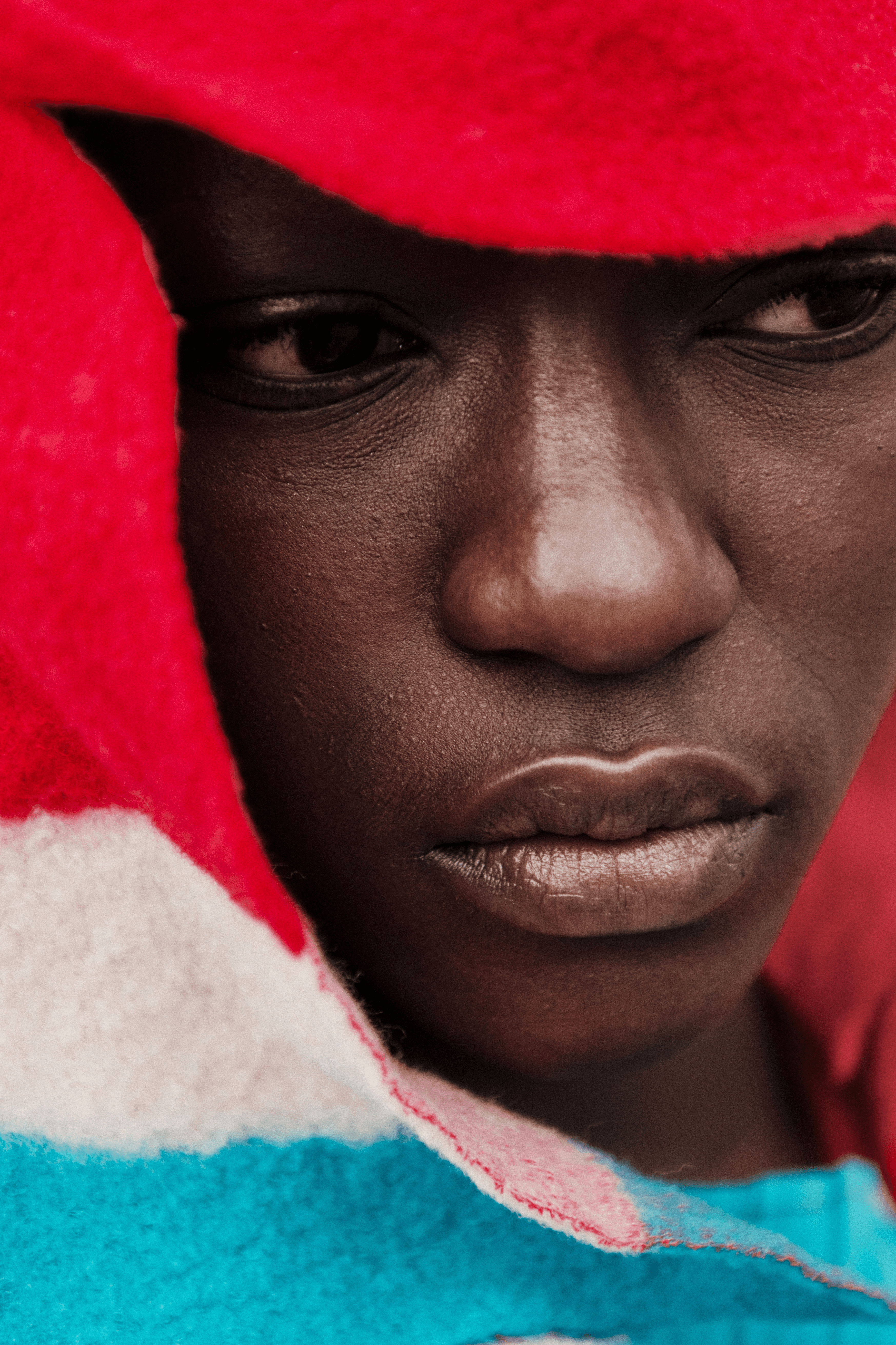 a woman holding a red flower