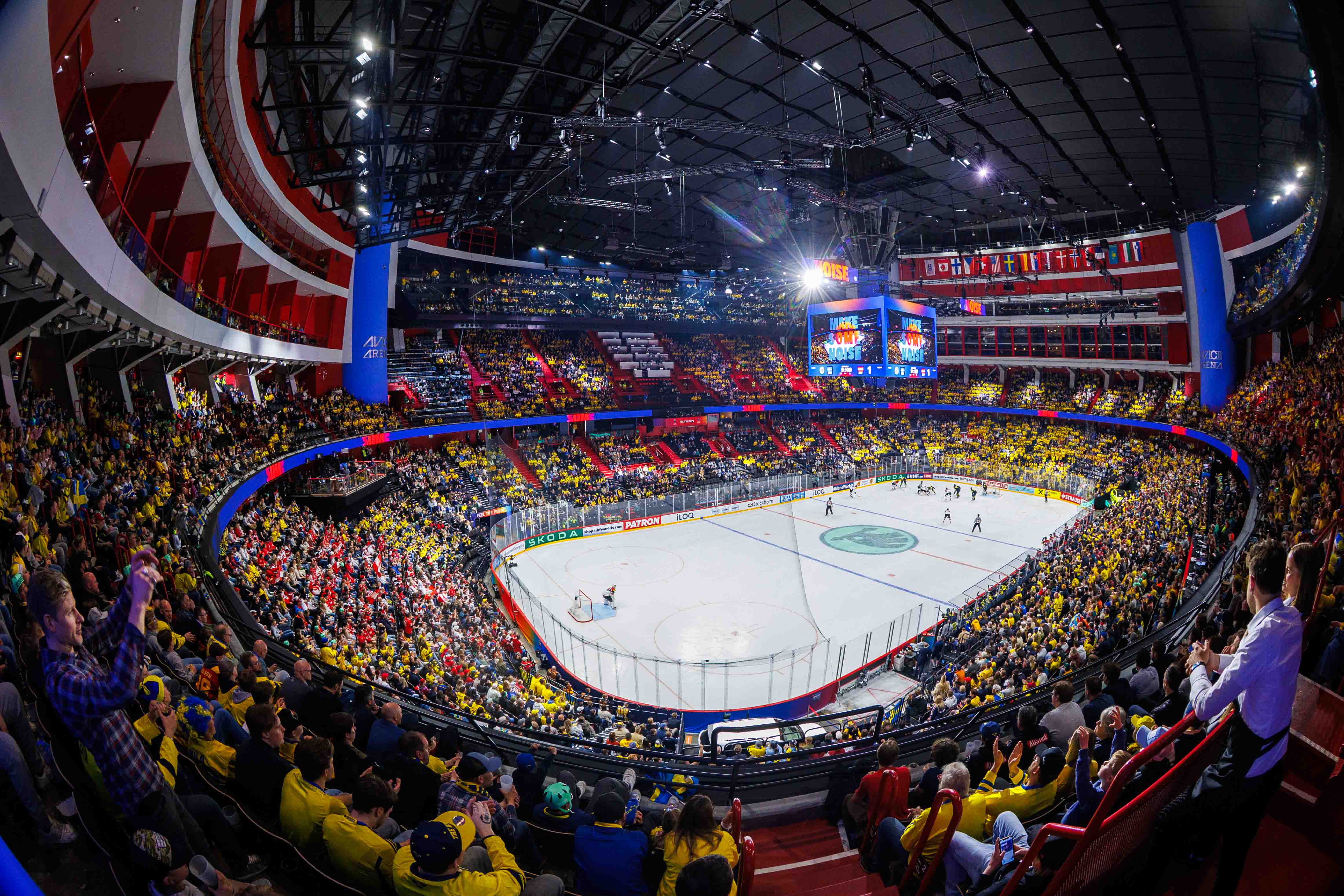 Aerial arena view capturing the scale of the IIHF Ice Hockey World Championship 2025 venue with full lighting and media setup.