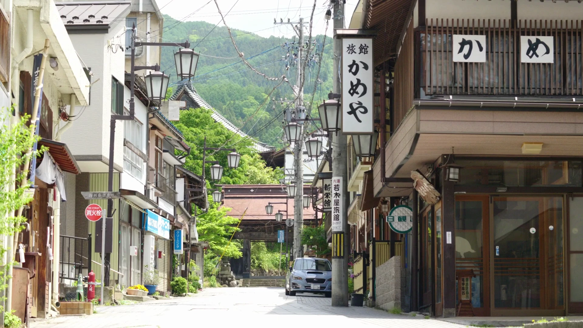 Lantern-lit old town street in Shibu Onsen at dusk