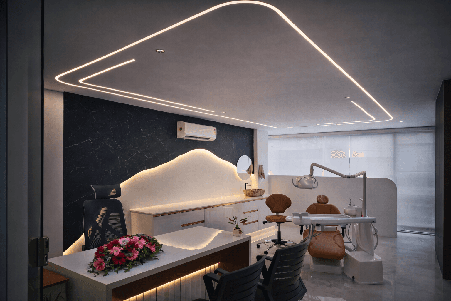 Modern two-story home with large glass windows, warmly lit interiors, and a balcony. Surrounded by trees and a manicured lawn at dusk. Cozy ambiance.