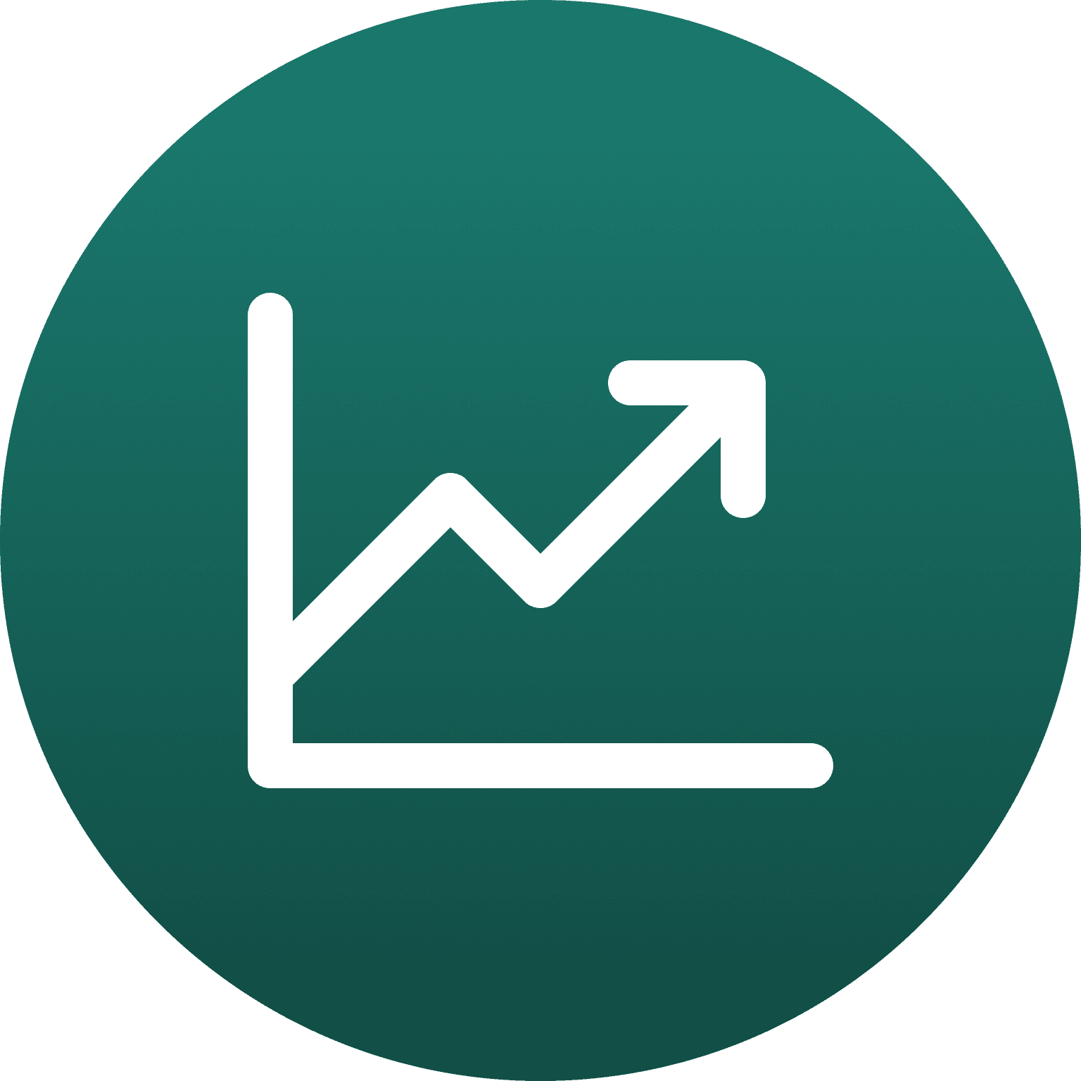 Smiling young woman with curly hair sitting at a laptop, in front of a teal wall.