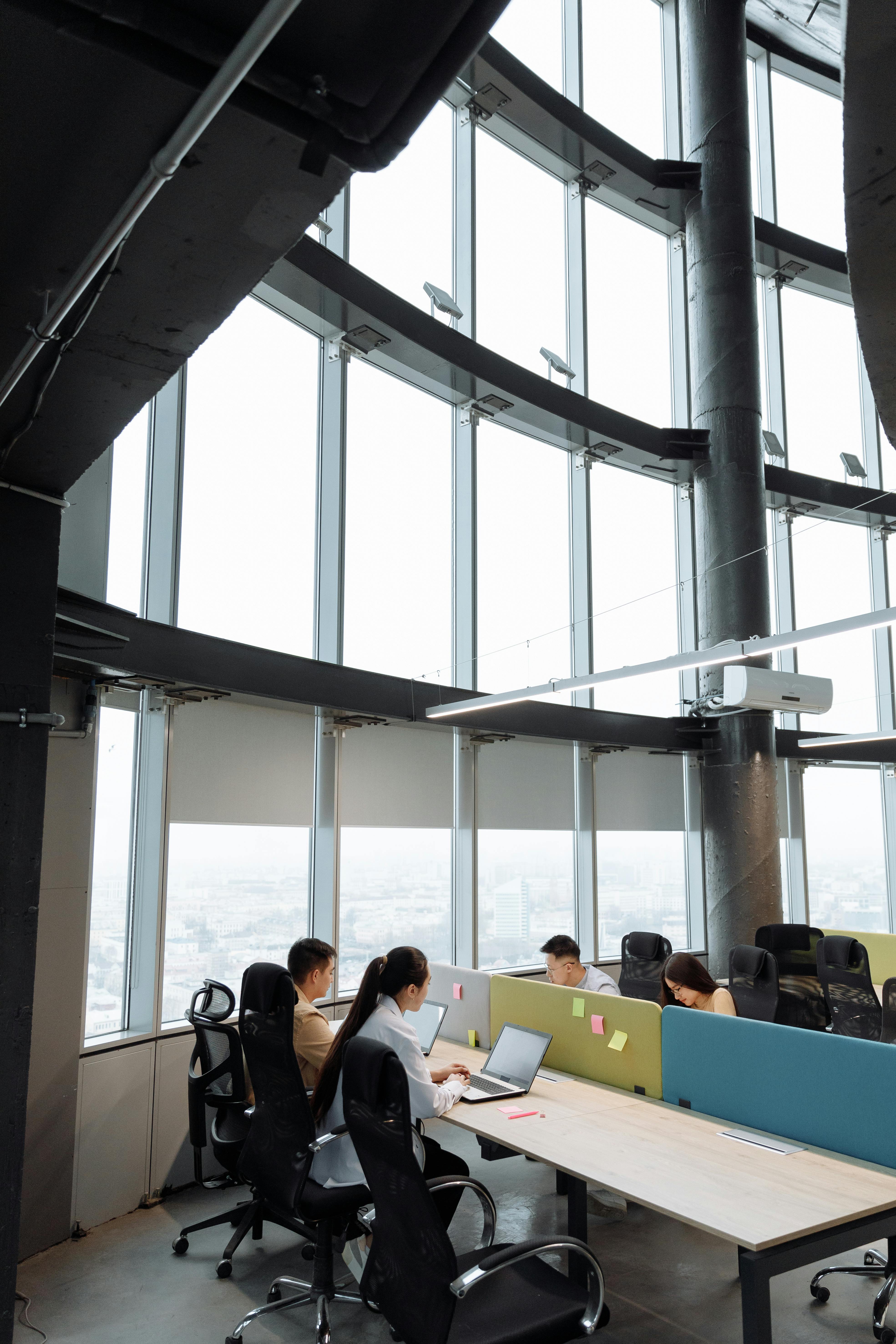 a woman using a laptop in a company