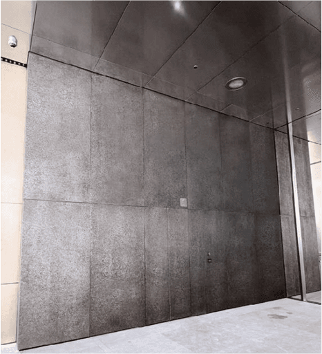 green hills with forest under cloudy sky during daytime