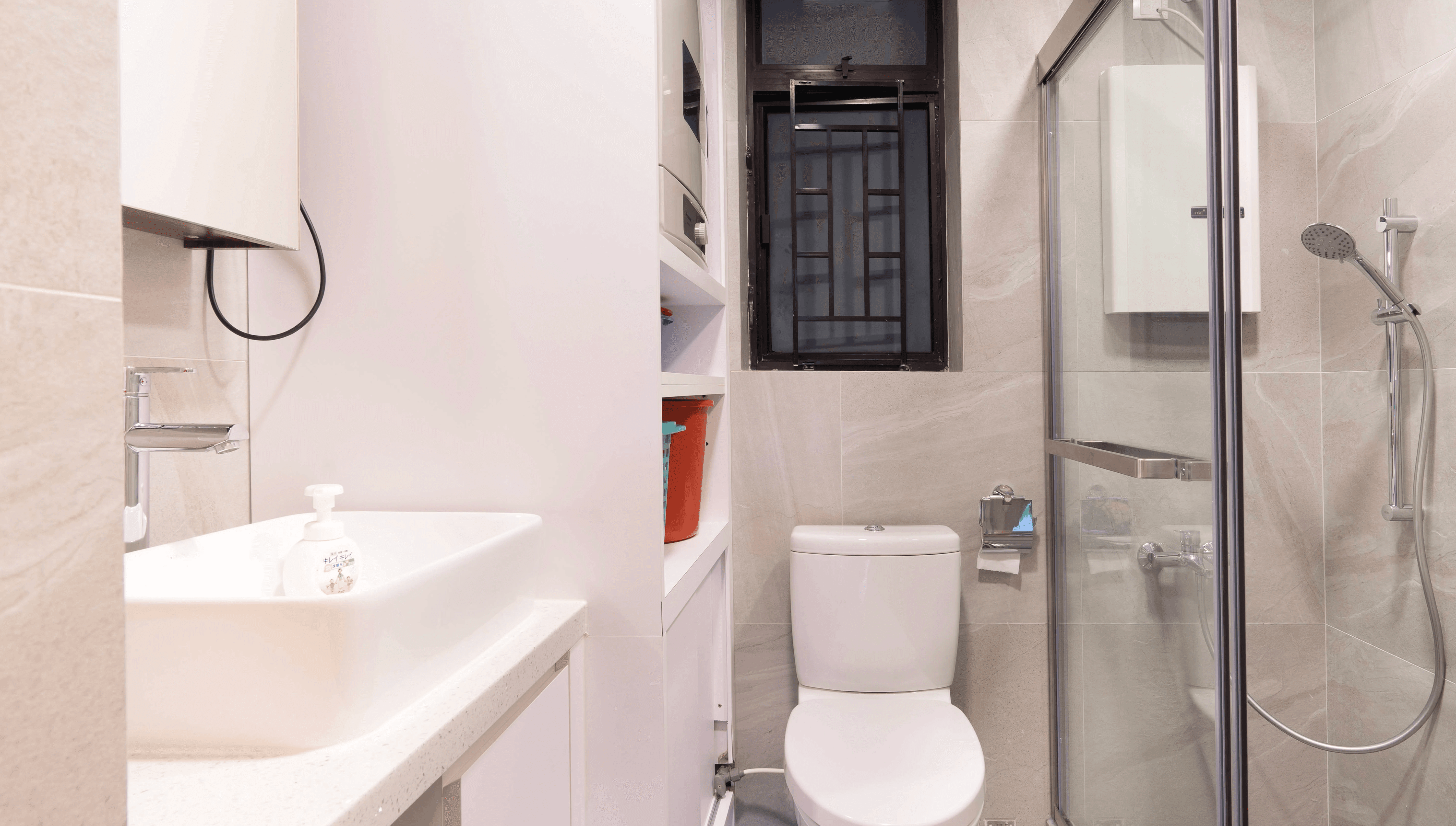Vertical white shelving units in a Castello bathroom design tiles arrangement offer organized storage next to a sleek, modern porcelain toilet.