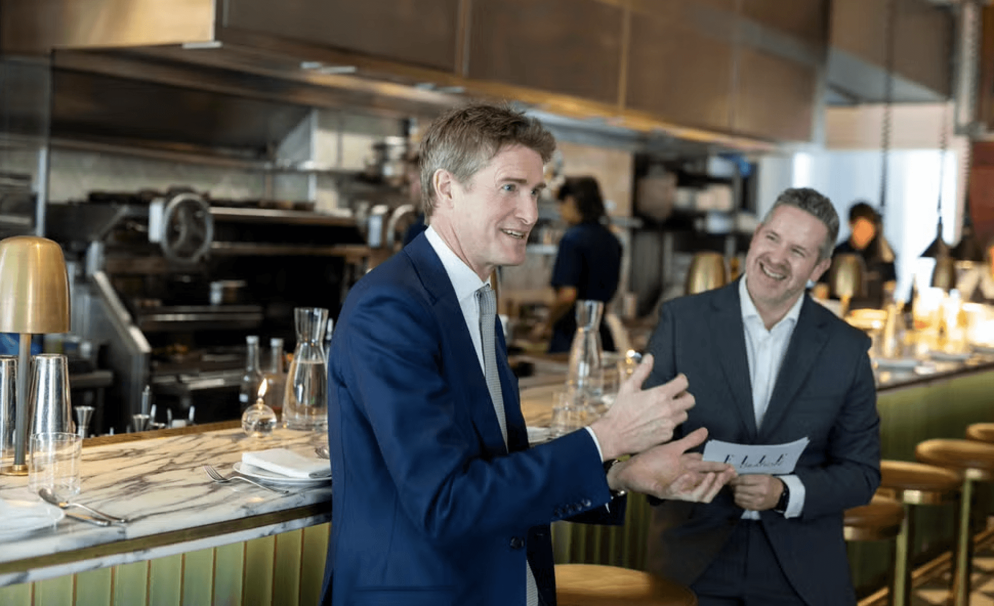 Bride in white dress walking on street, blurred motorcycle passing