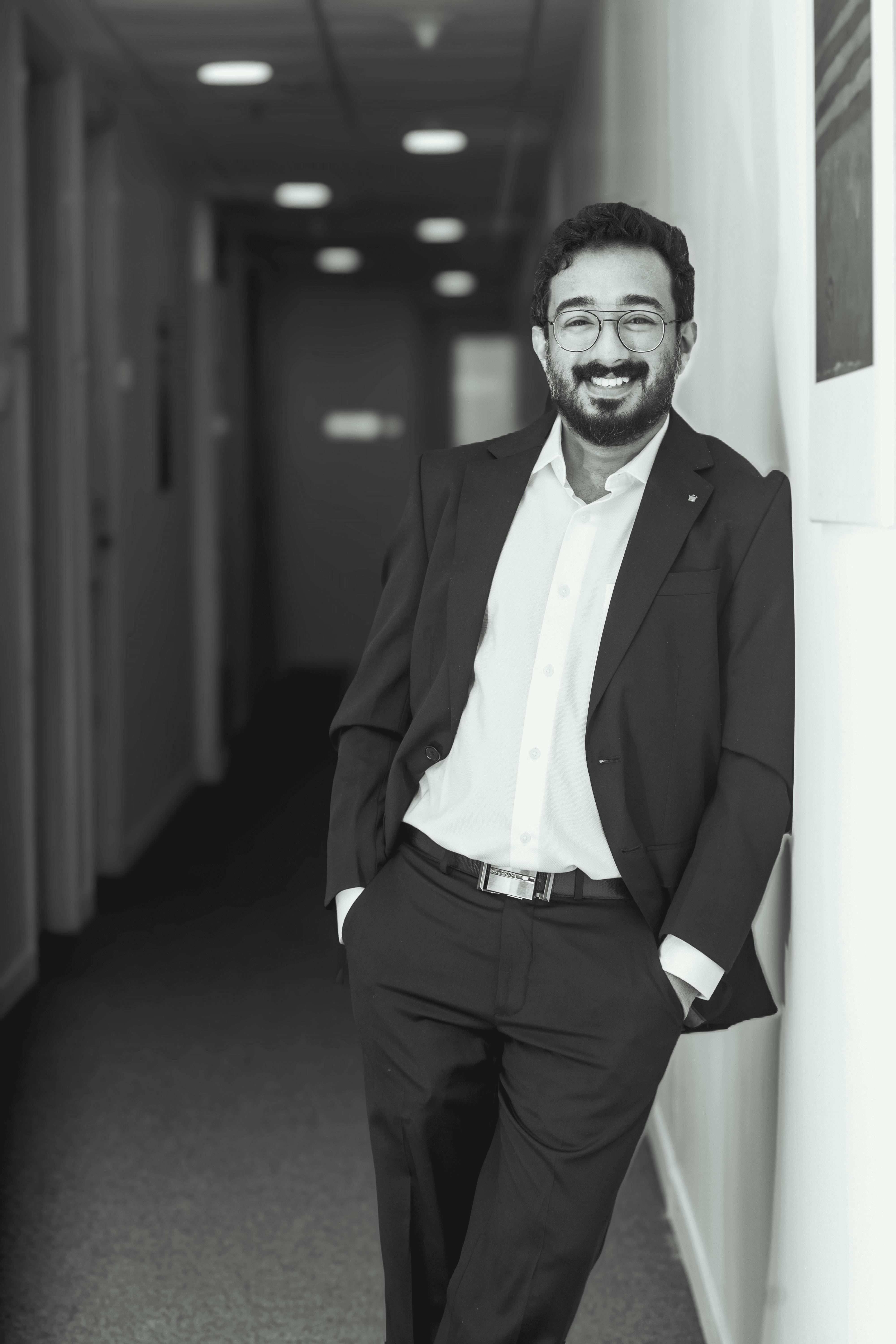 Photo by Atul Mohan: https://www.pexels.com/photo/professional-businessman-smiling-in-office-corridor-36645466/