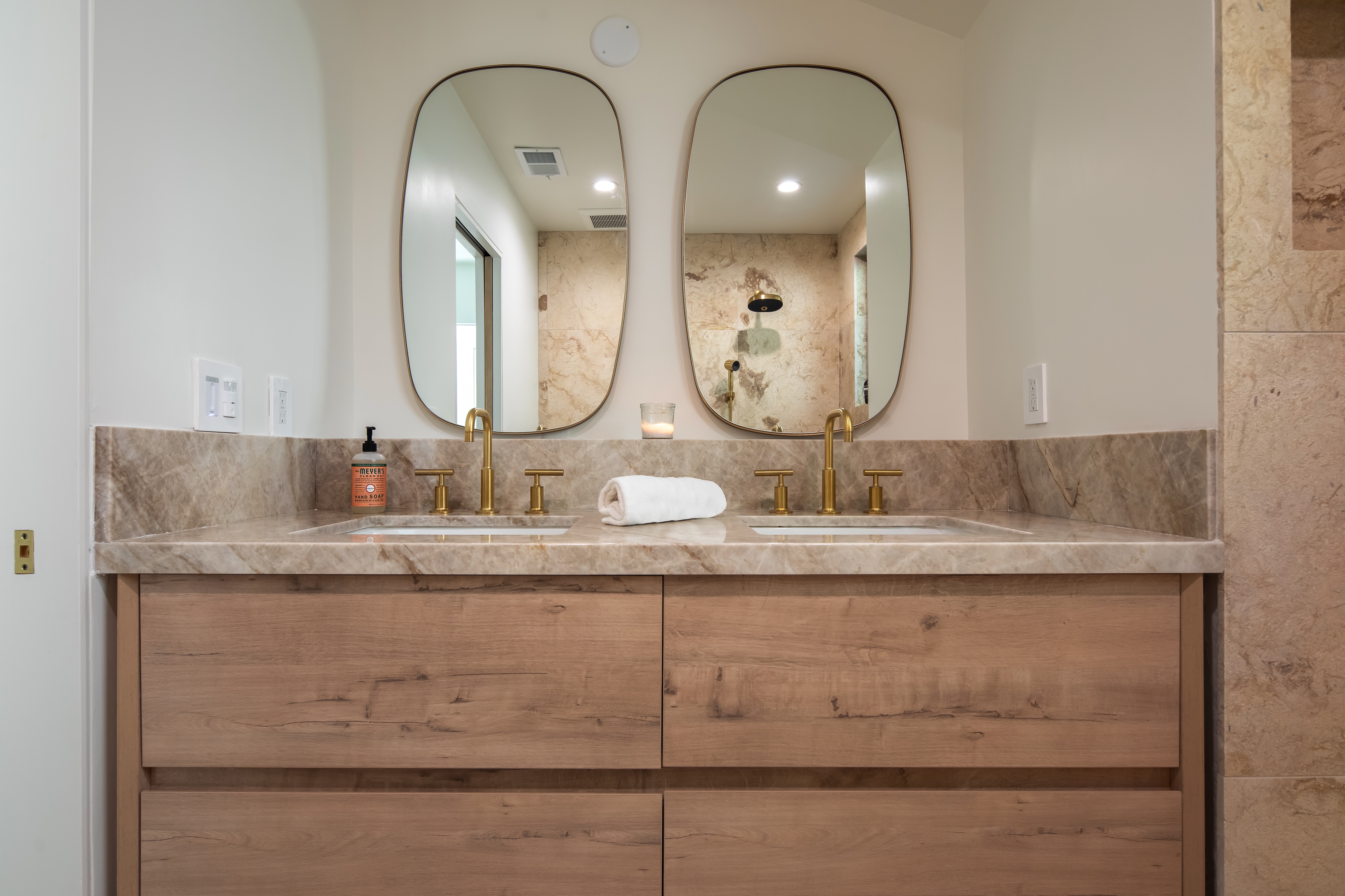 Modern hillside house with stilts and glass railing