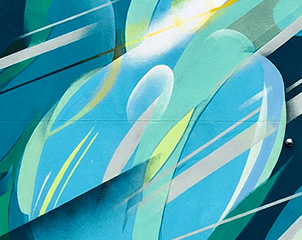 A close-up of a pink cocktail in a martini glass, set against a nighttime background with soft, blurred colors.