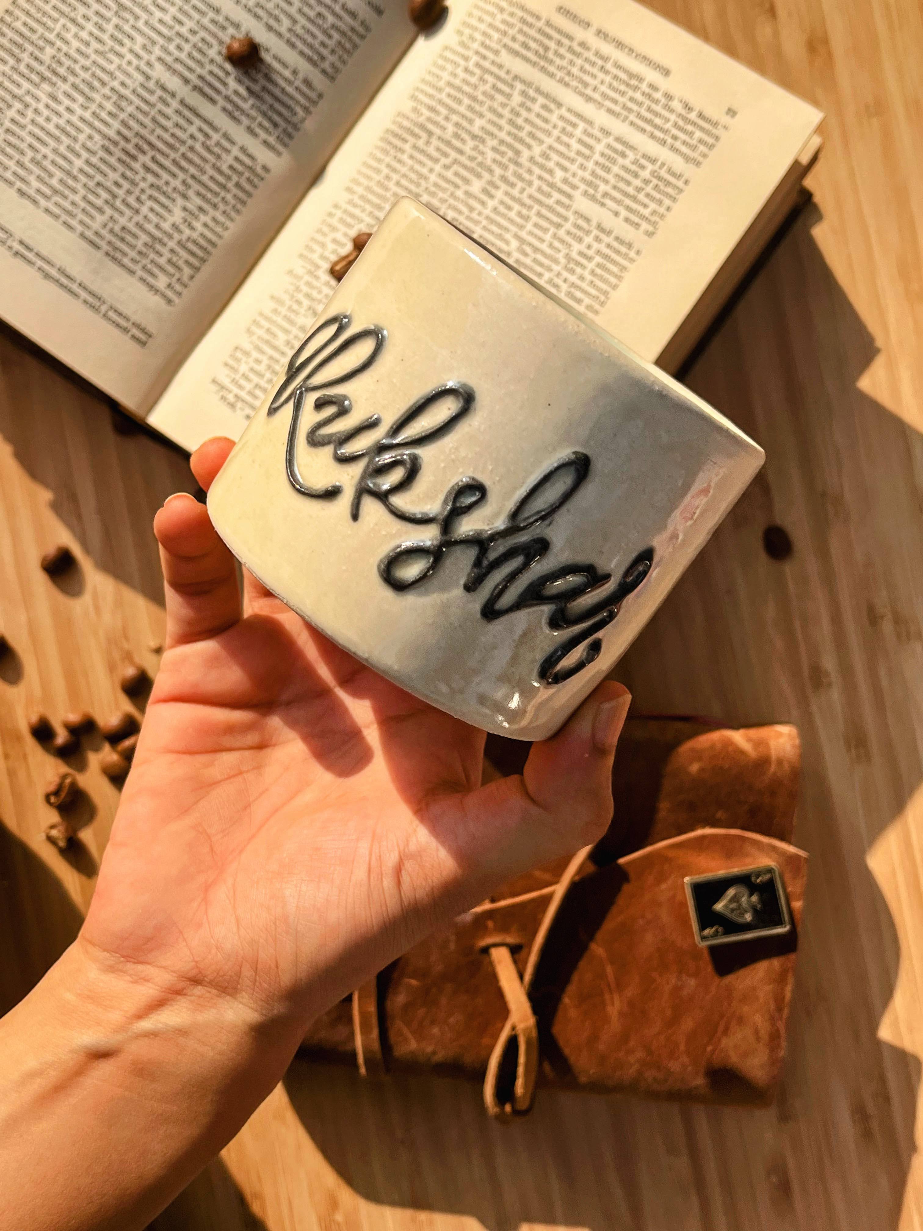 Elegantly crafted handmade ceramic mug with a distinguished embossed name. This personalized masterpiece adds a touch of sophistication to your coffee or tea moments.