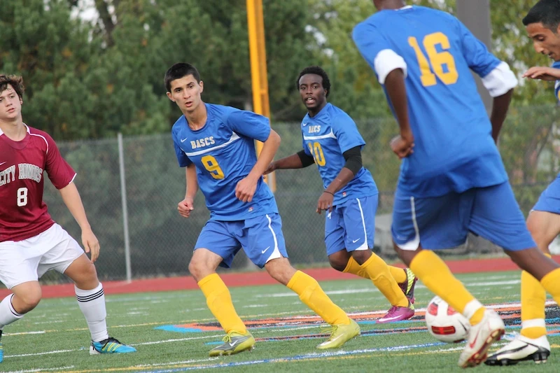 BuffSci high school students playing soccer during athletics program