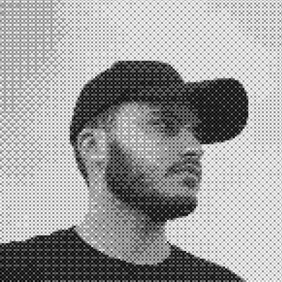 Portrait of Framer creator Zineddine Kessaimi wearing a black cap.