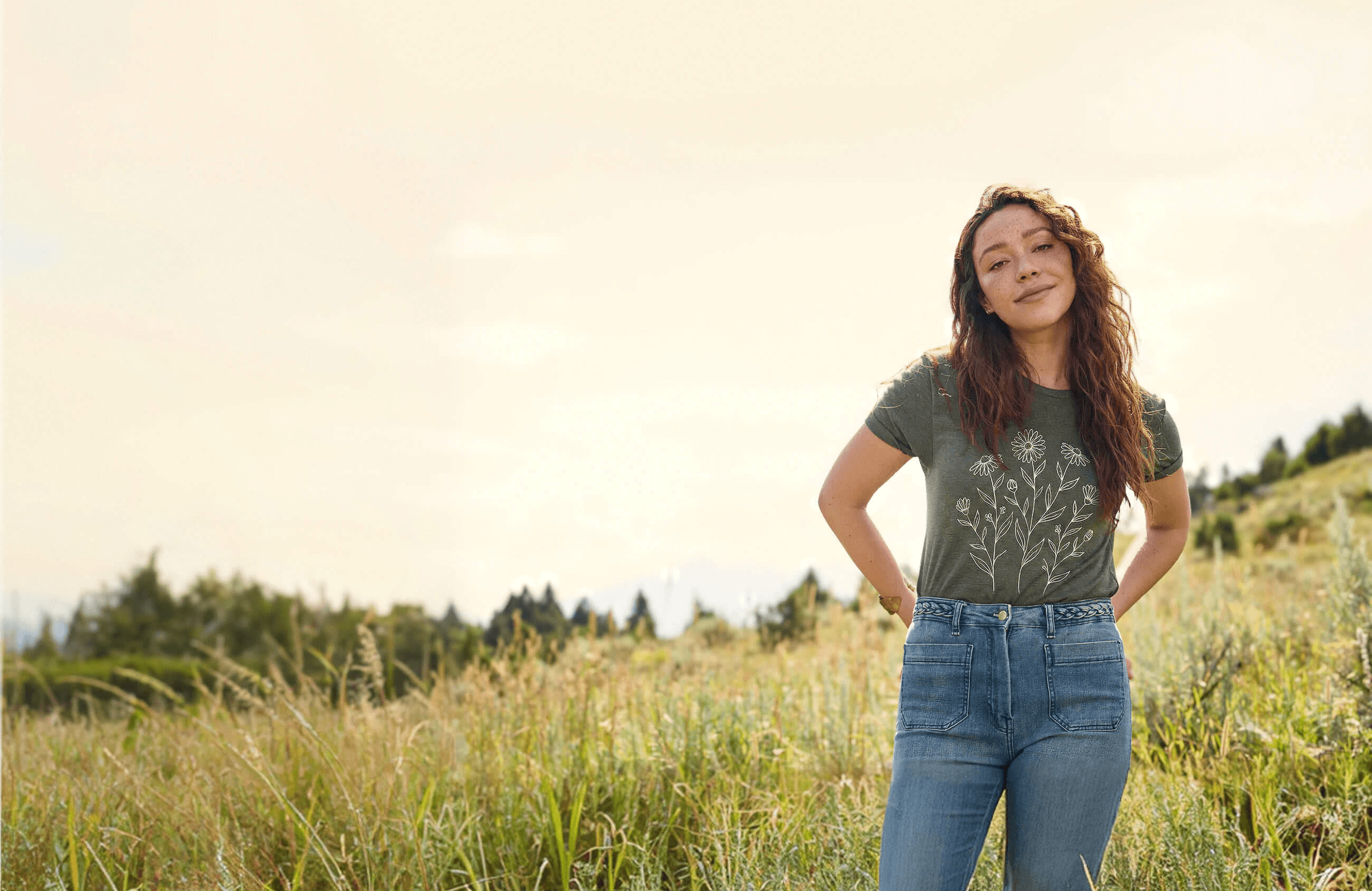 Two people wearing matching gray hoodies, one with a beanie.