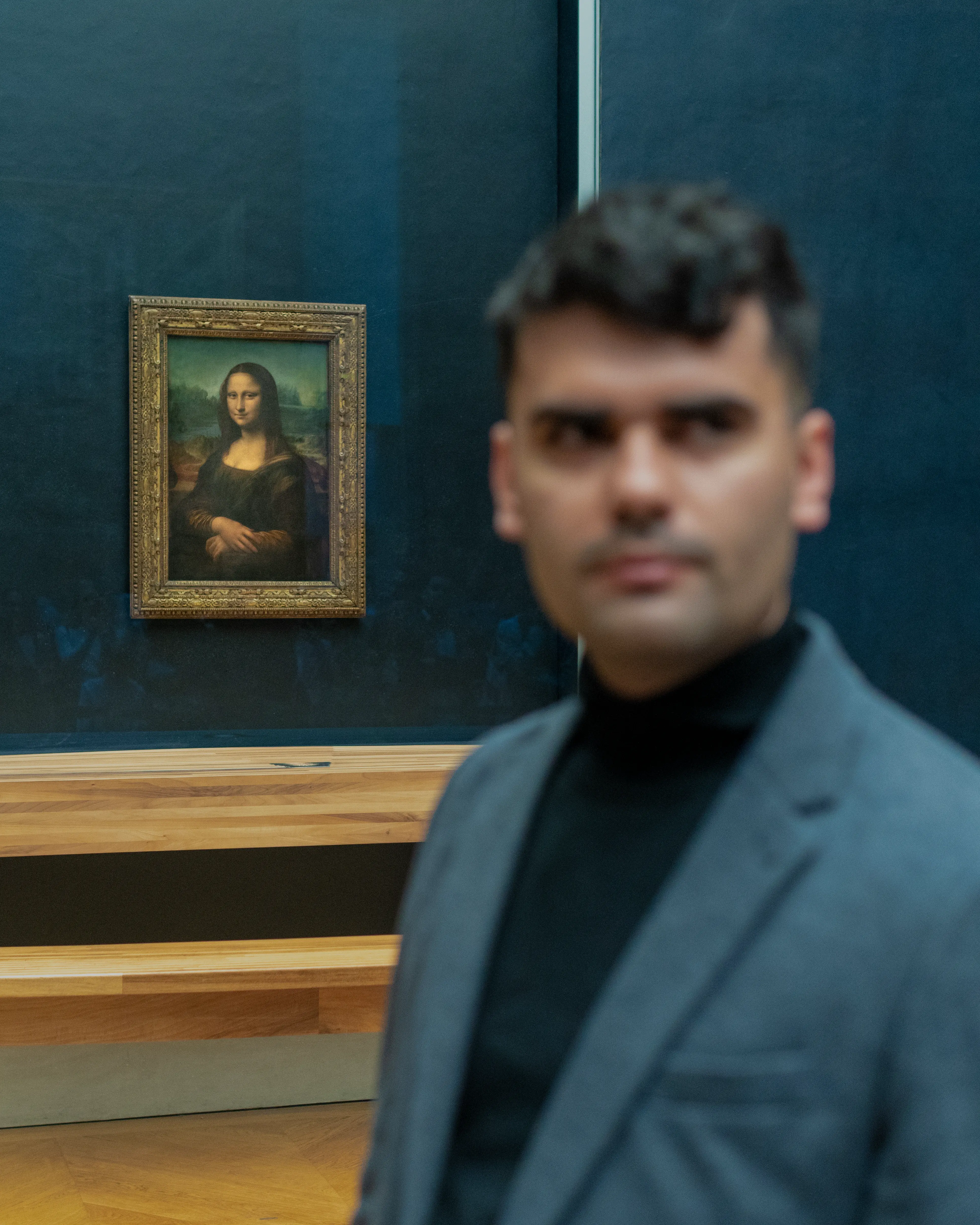 Person, holding a white rose behind his back with one arm on a light blue background