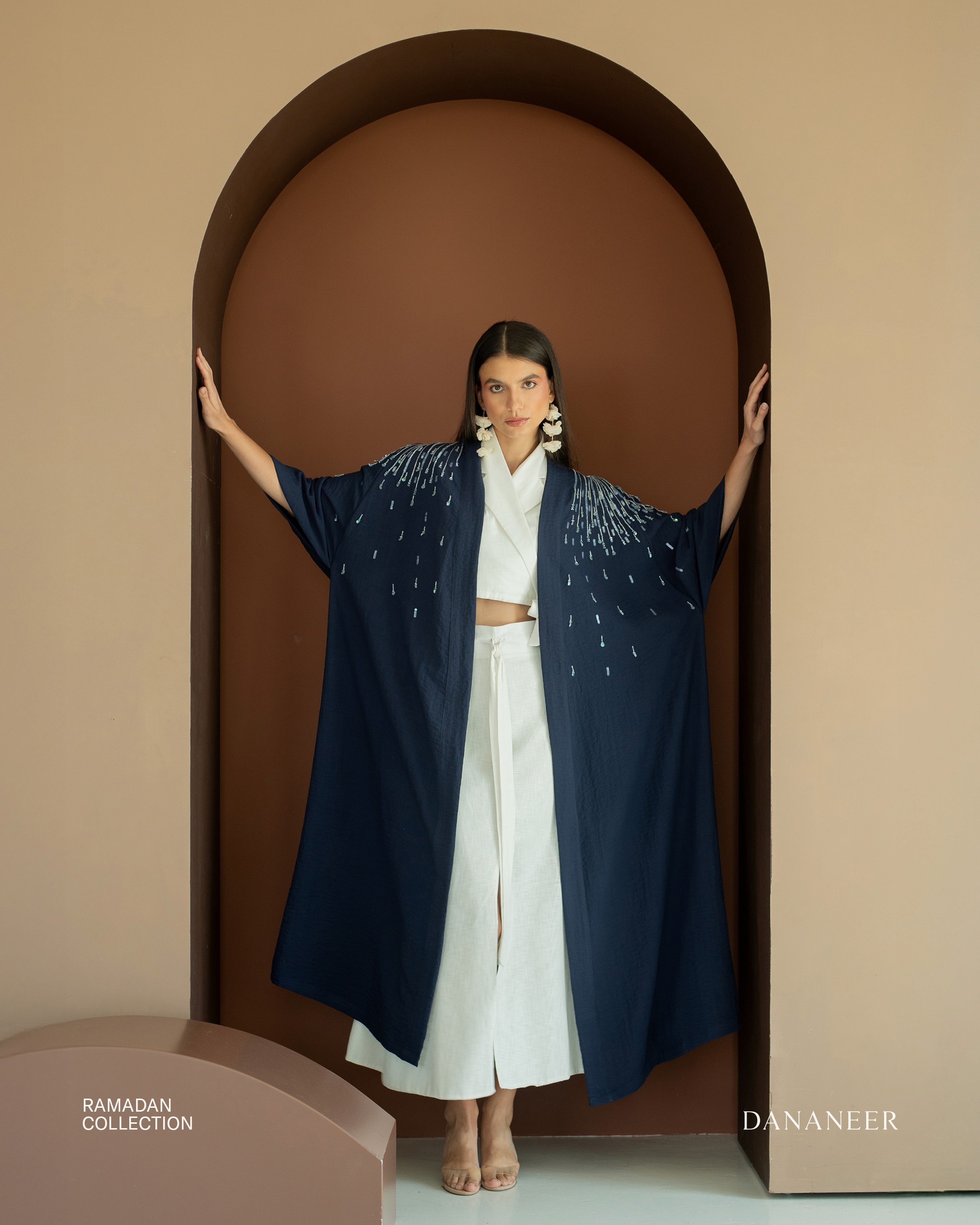 Fashion photoshoot with a woman posing in a dress