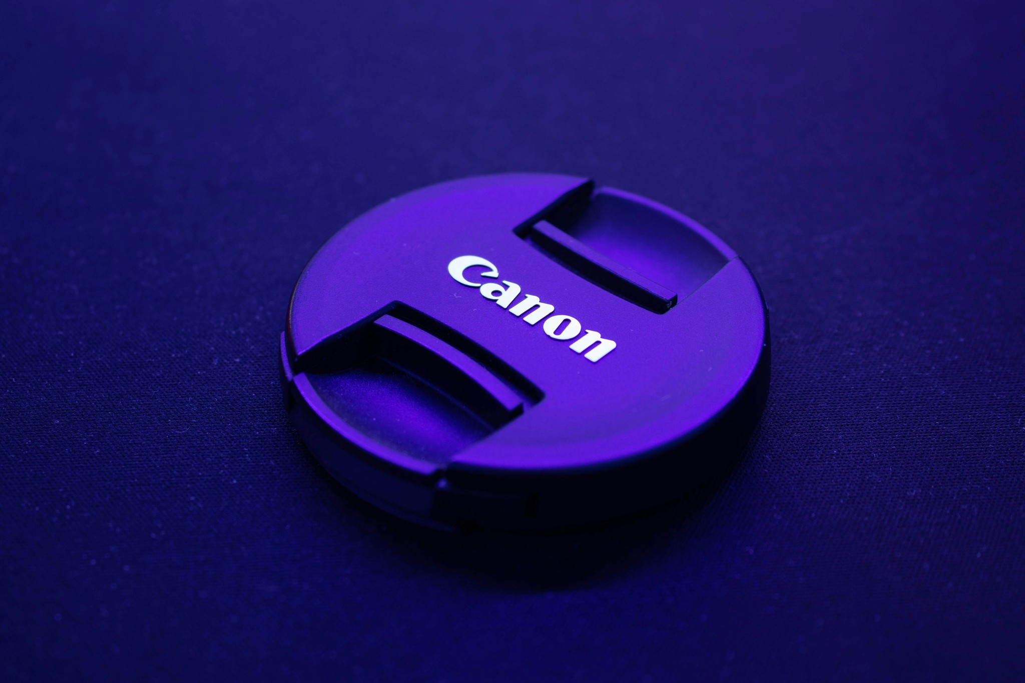 black canon camera lens cover