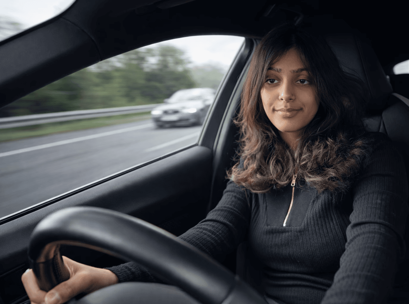 Auto-Learners student sitting in the driver’s seat of a car