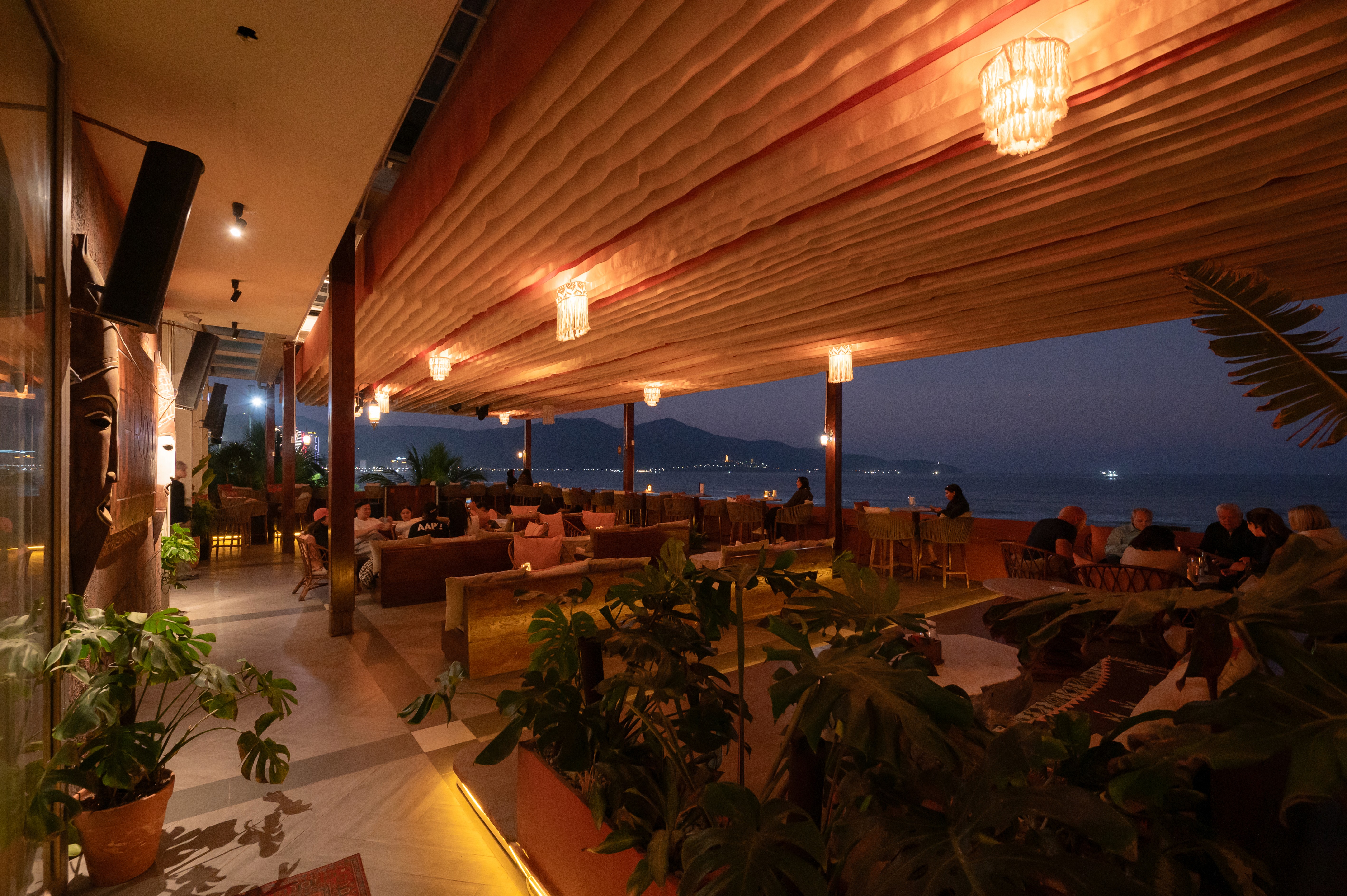 Rooftop bar Da Nang at sunset — The Roof beachfront lounge above My Khe Beach