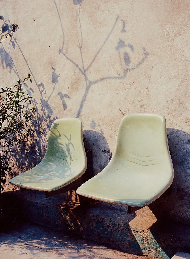 Woman with red hair covering mouth with hair