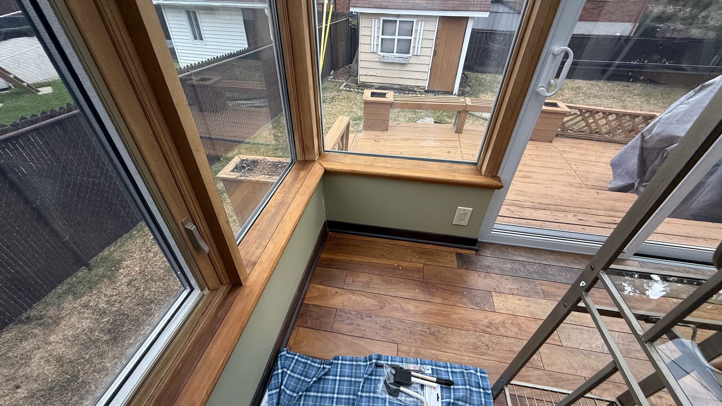 Freshly restained sunroom window sills in Laval