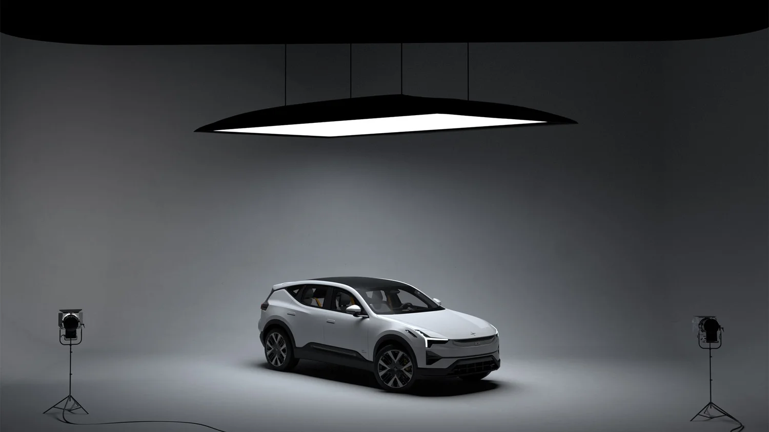 Four diverse professionals collaboratively working on a laptop, with one person pointing at the screen while others observe.