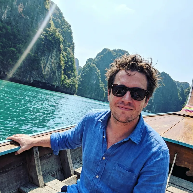 James on a longtail boat in Thailand