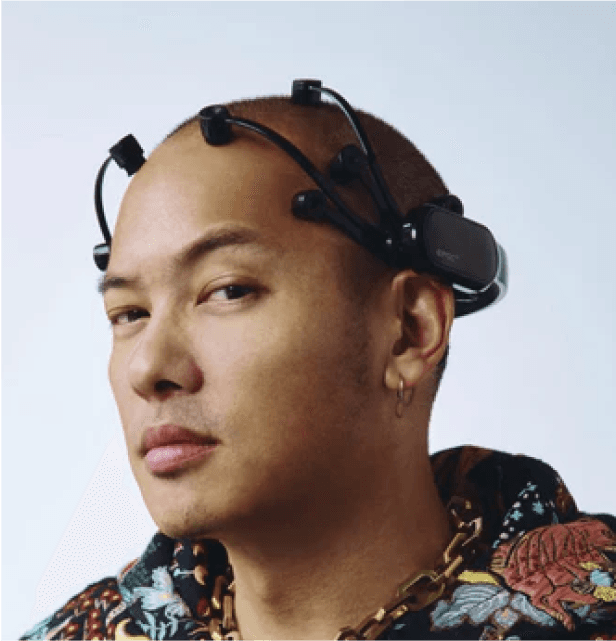 Man wearing Emotiv EEG headset