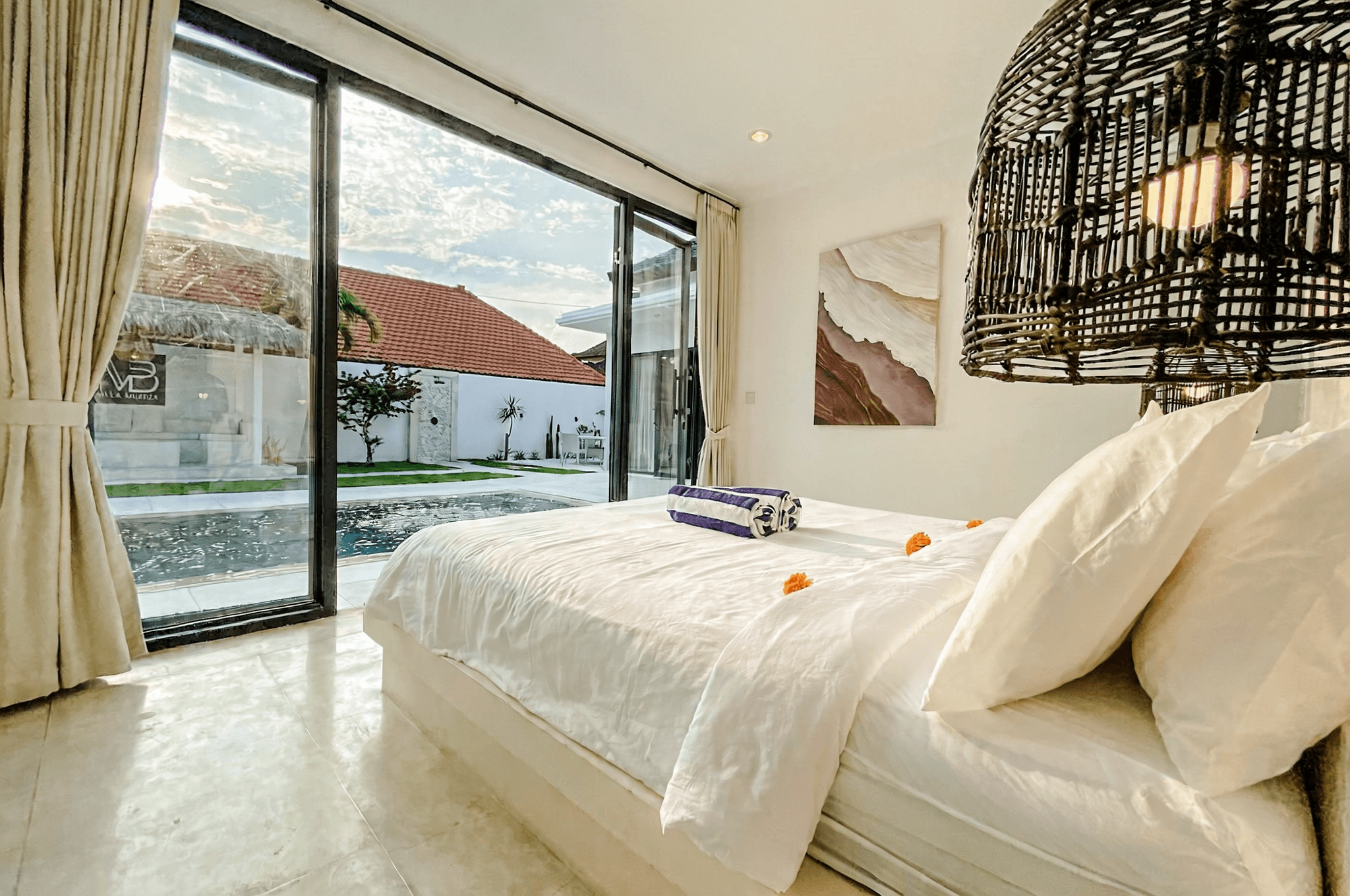 Modern bedroom with pool view. Professional real estate guidance for finding your dream home in Kerobokan.