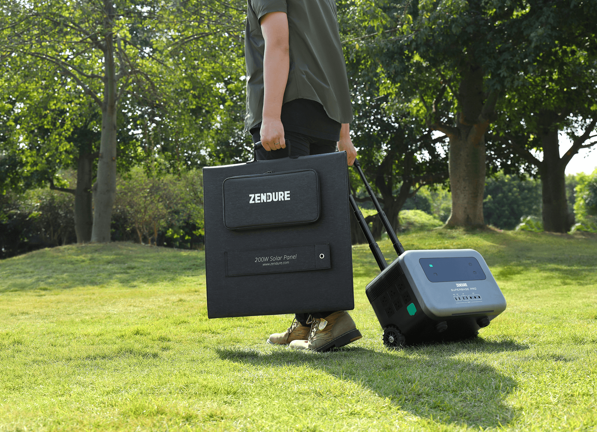 Person carrying portable solar panel and power station