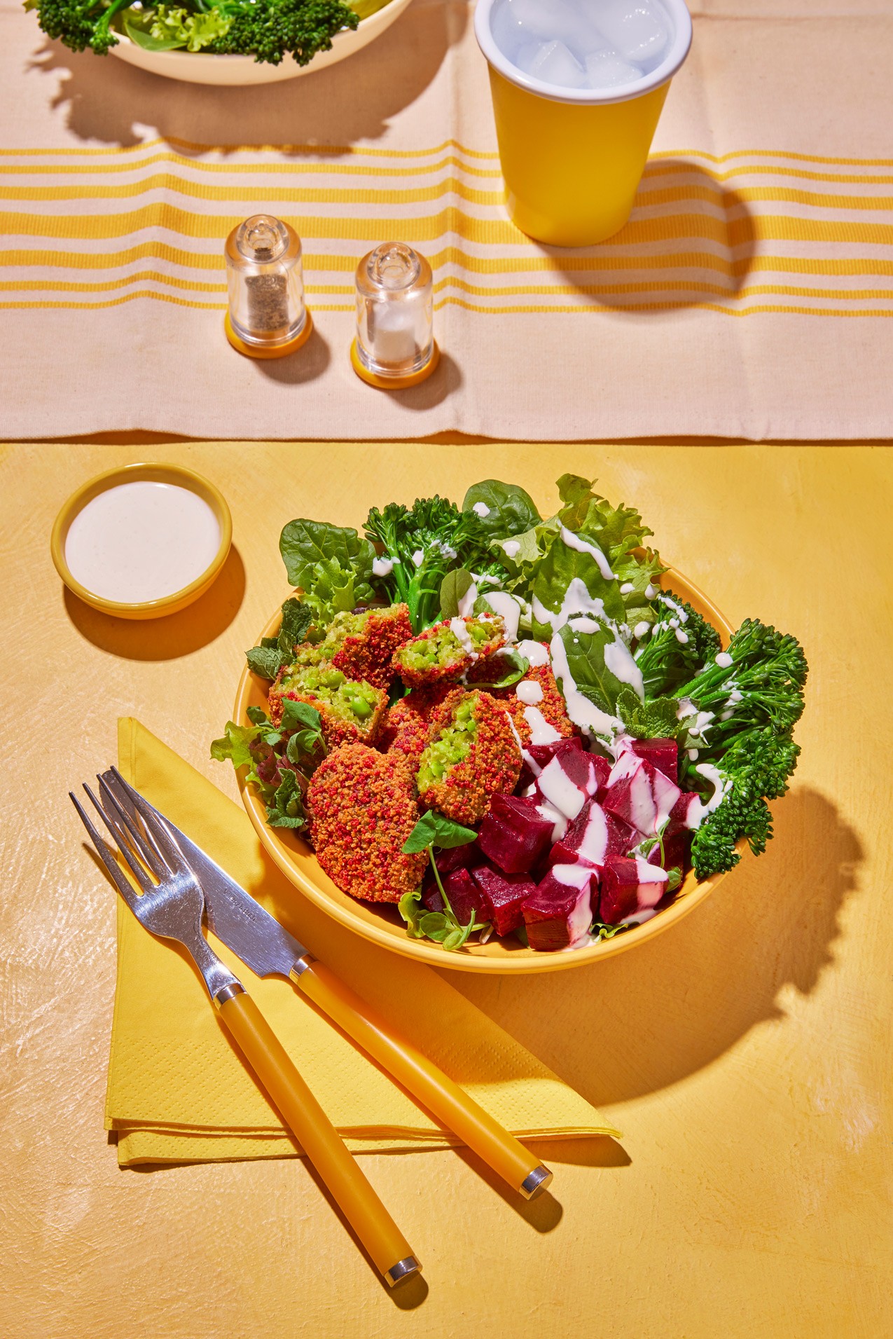 Spinach bites with salad, showing client work for food brand Strong Roots.