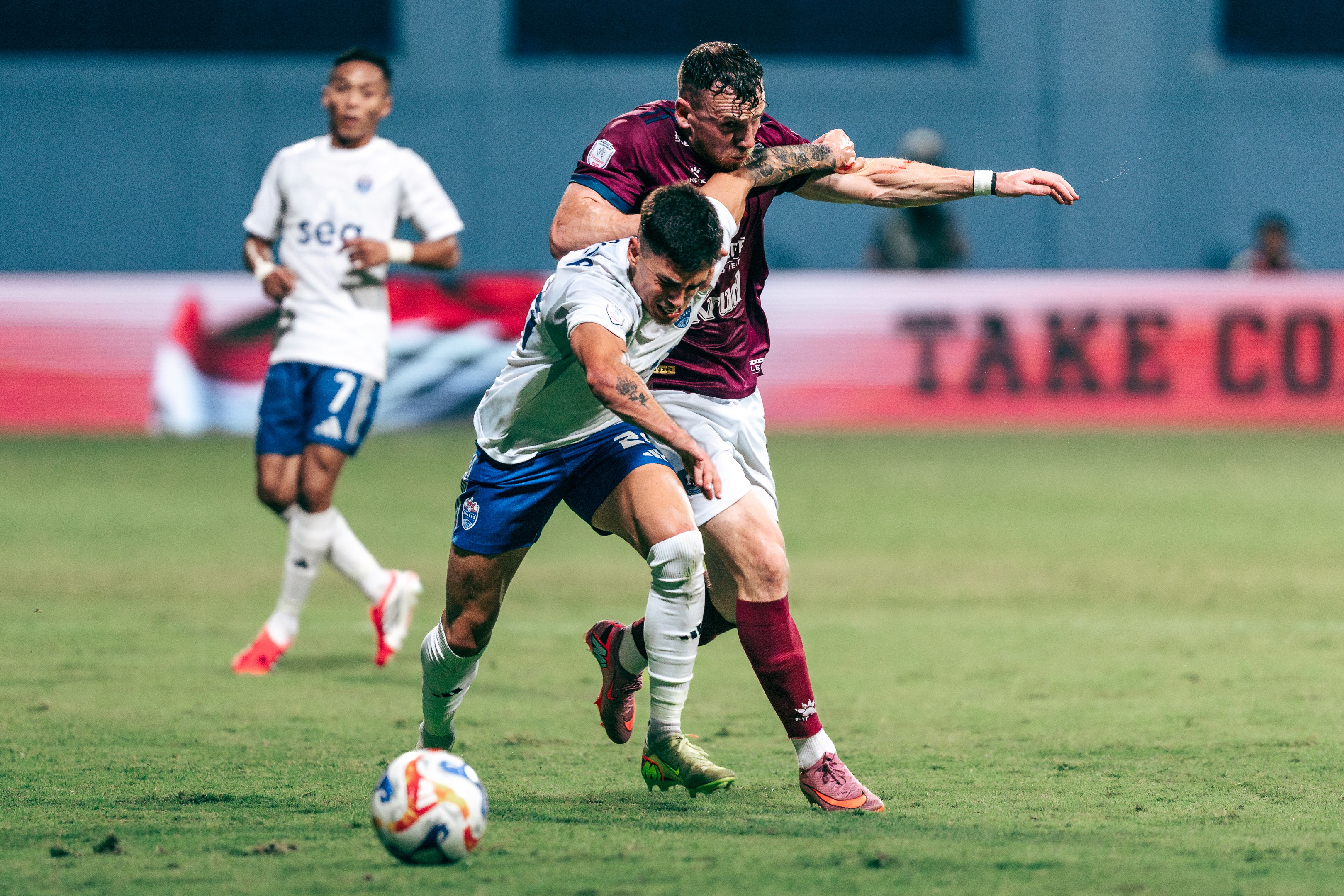 Diogo Costa tussles with Connor Shields in a match between Lion City Sailors and PKR Svay Rieng in the ASEAN Shopee Cup 2025/26 at Jalan Besar Stadium, 2025