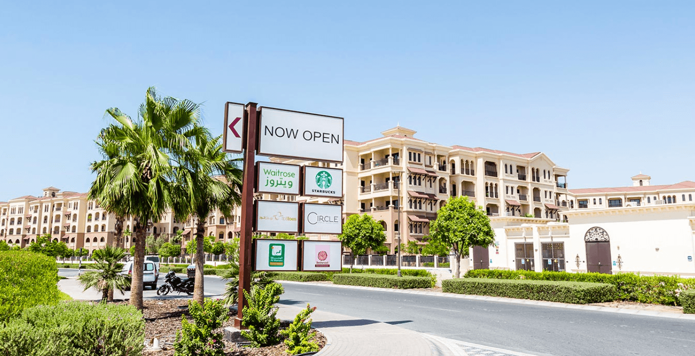 Sign for the Saadiyat Island apartment complex displayed on the roadside.
