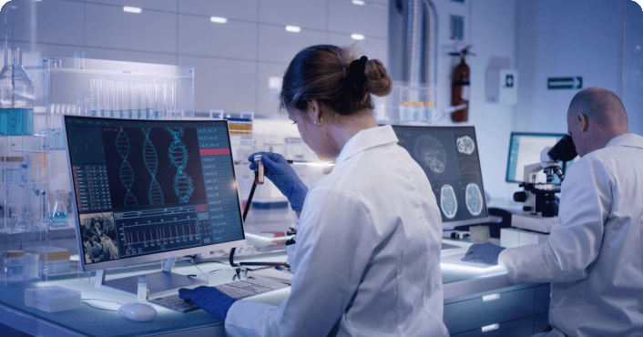 Scientists working in laboratory analyzing samples and data.