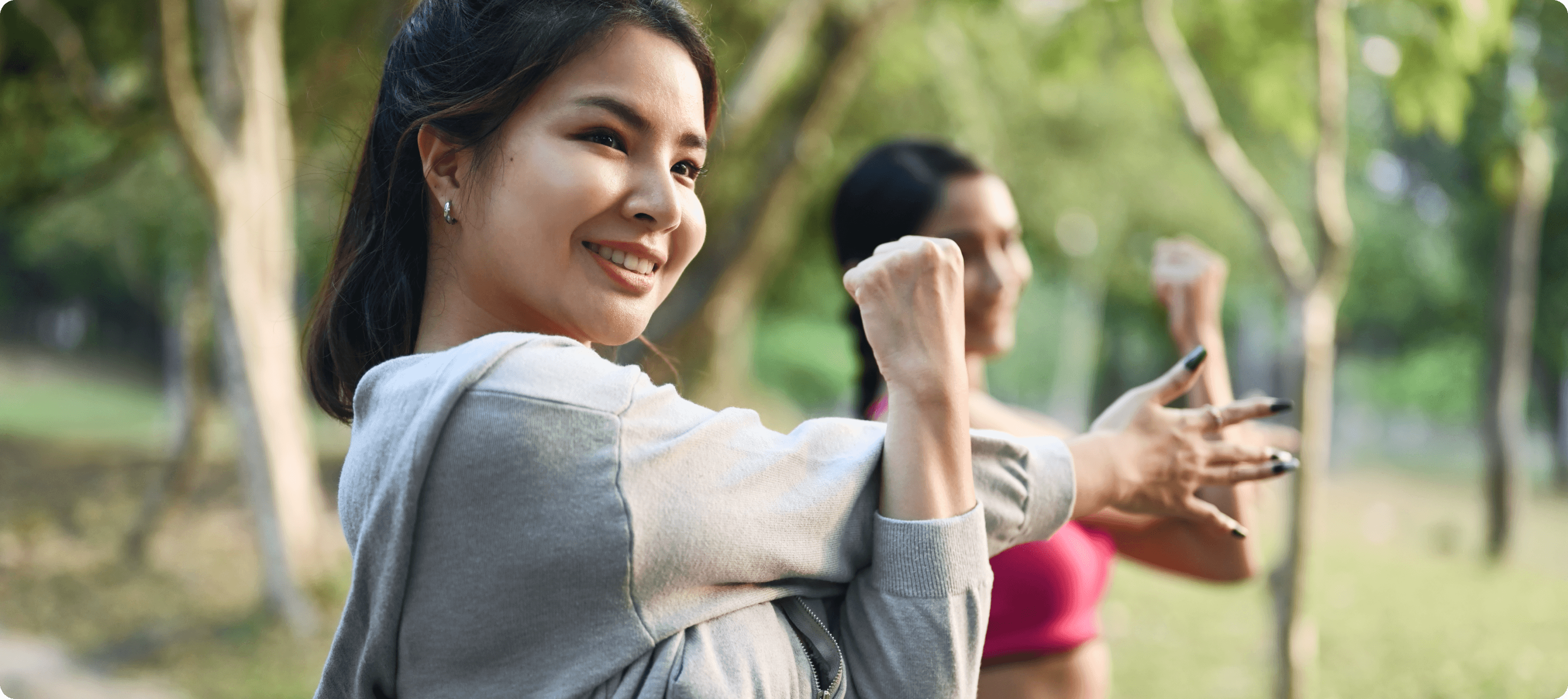 Happy Filipina woman stretching and practicing a healthy lifestyle