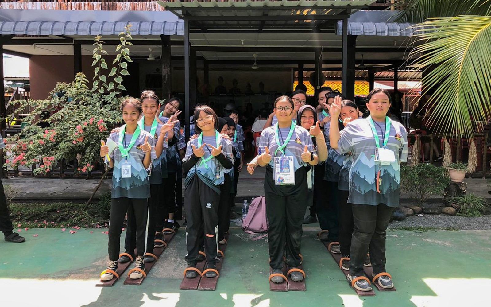 Visitors participating in a traditional group activity at Koisaan Cultural Village.