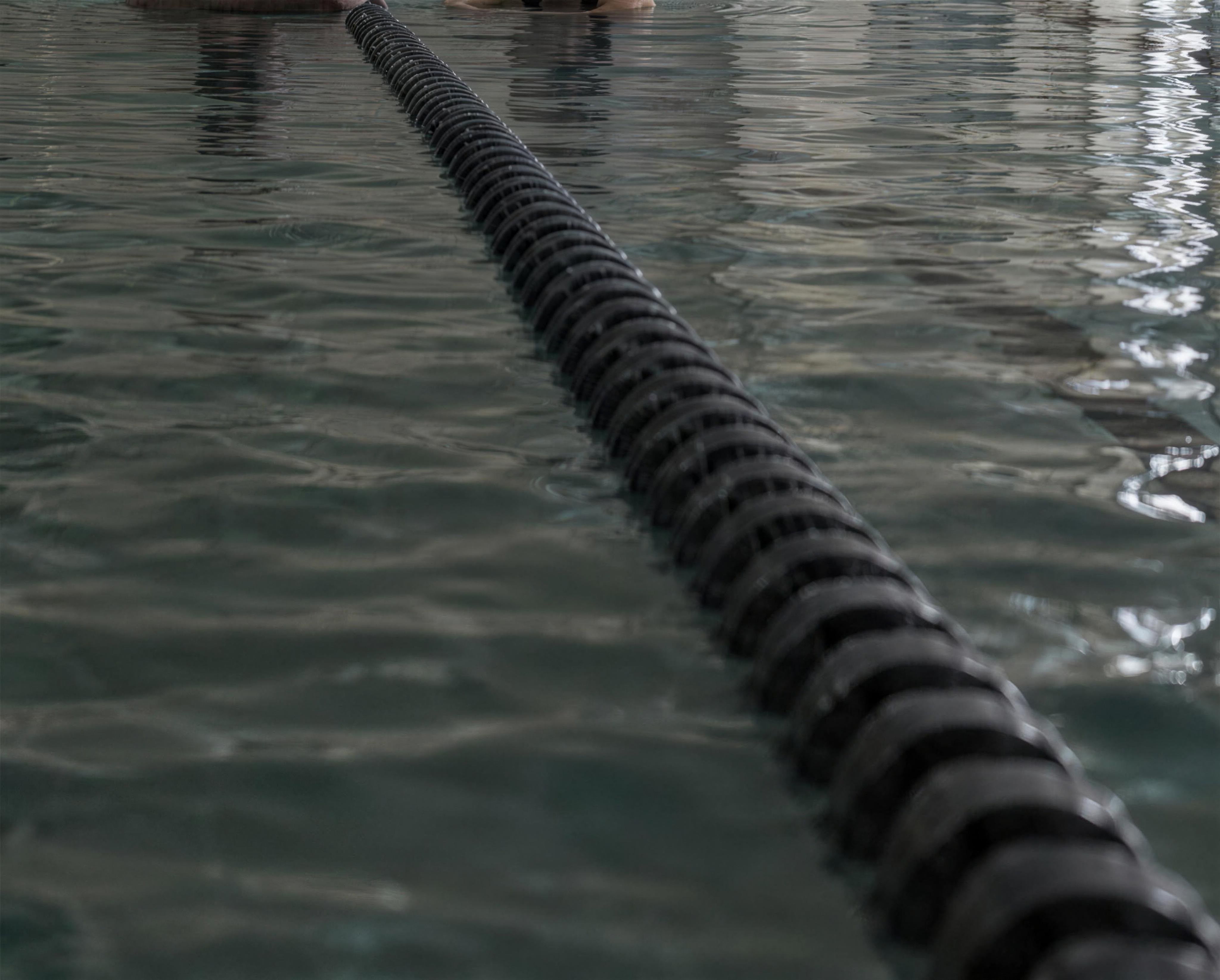 A lane rope running across the pool before an early session