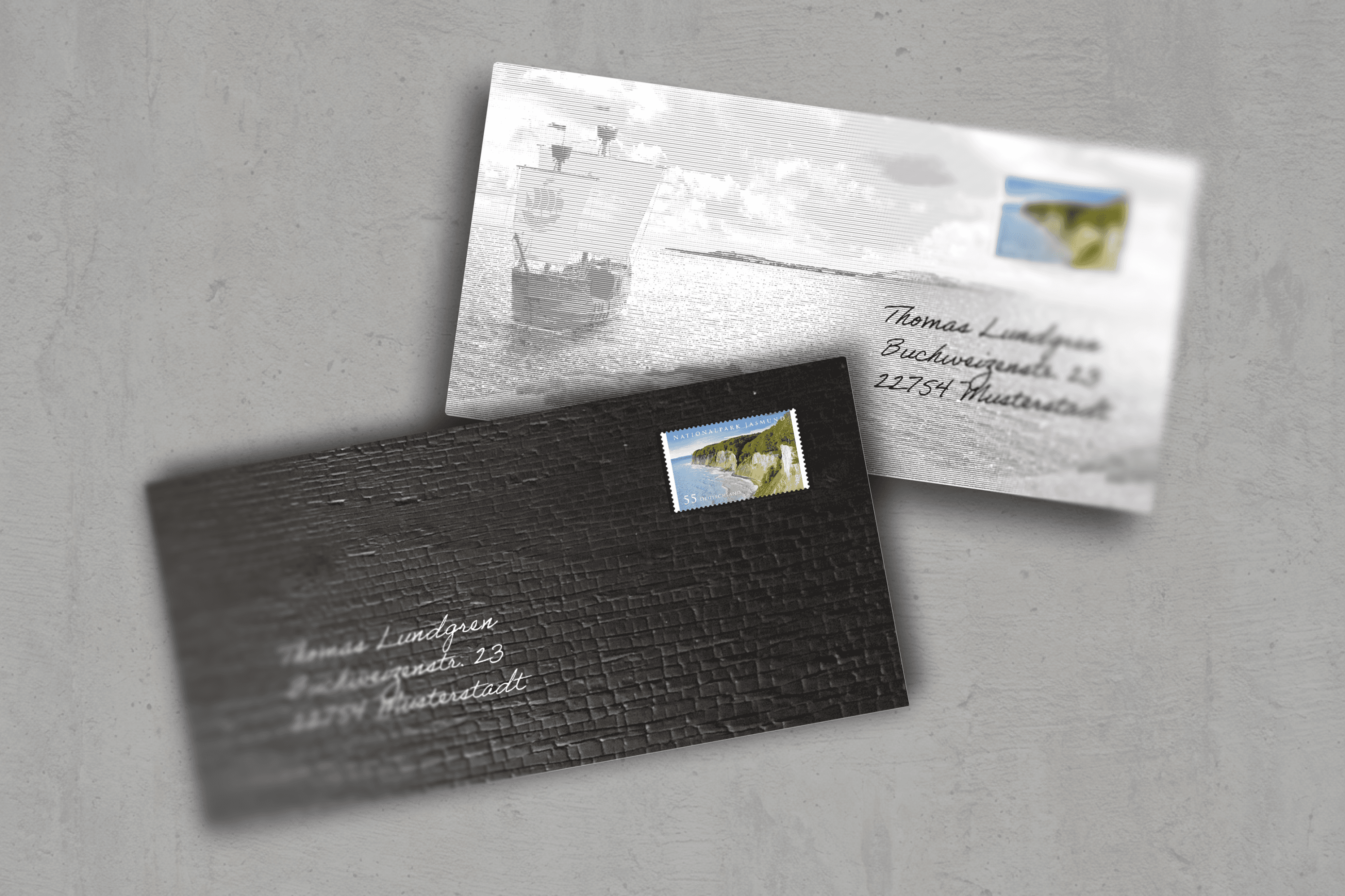 Two envelopes with postage stamps and addresses.