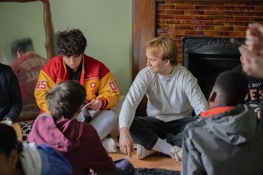 red mail box on road during daytime