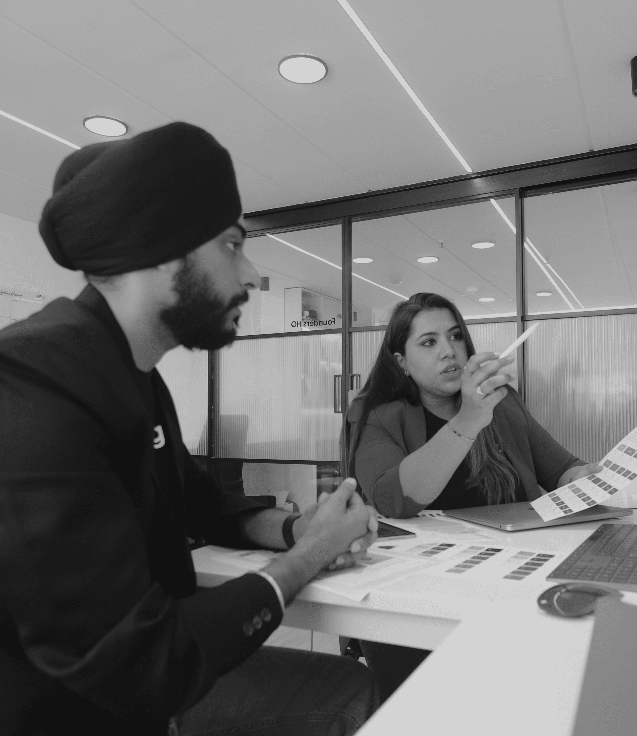 Interior of a cafe or workspace with several people at tables