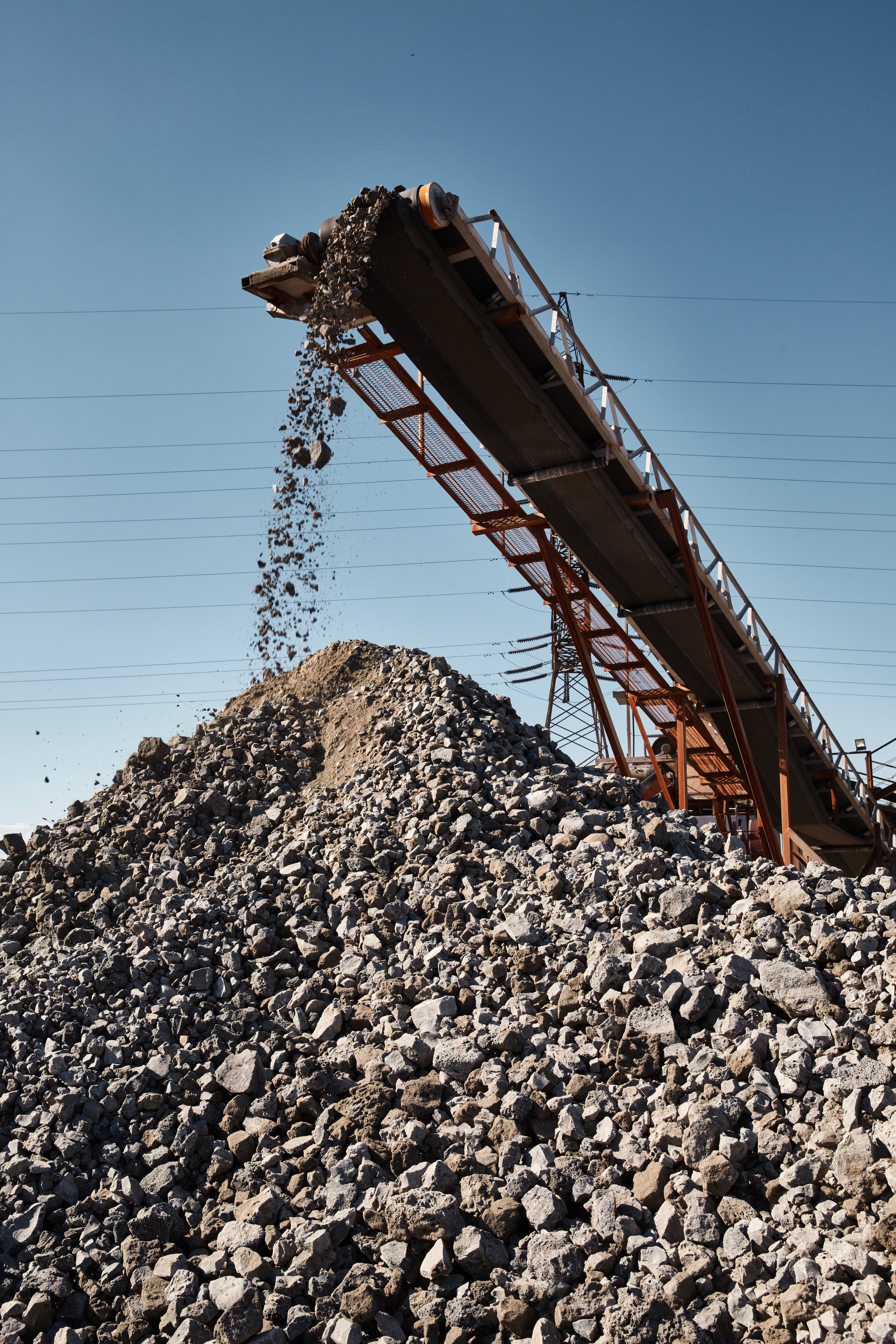 A person stands in a sandstone cave.