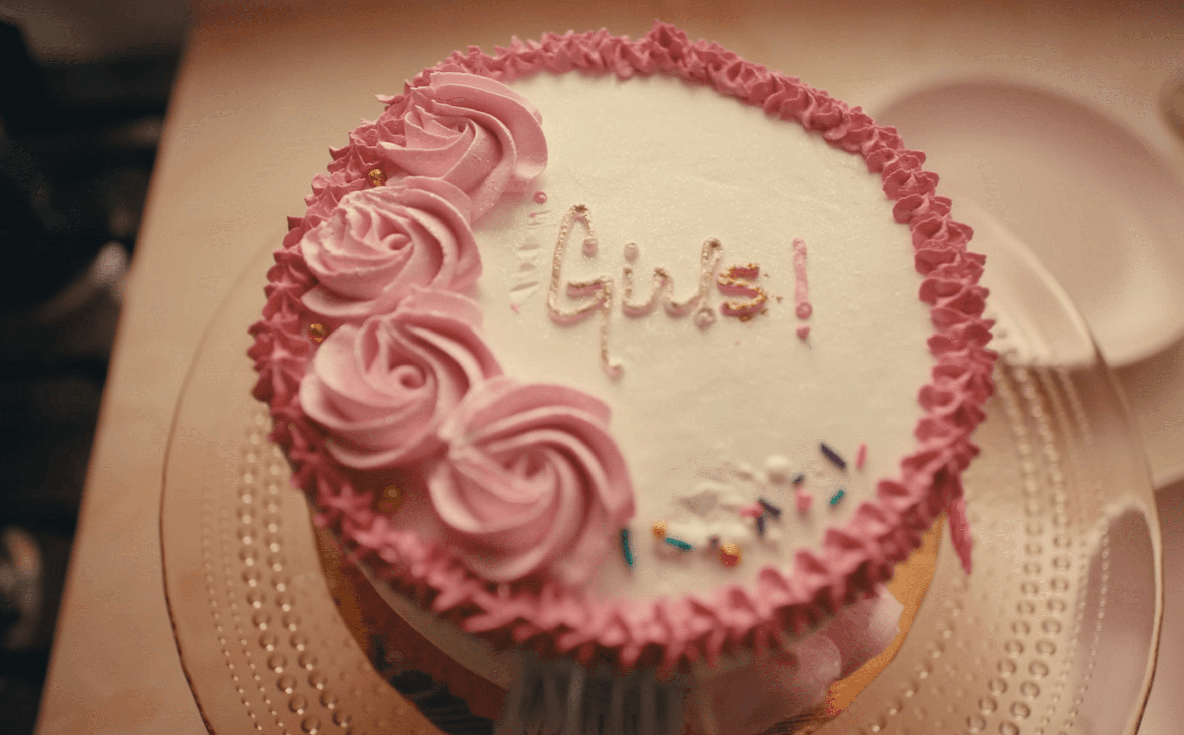 Family picking apples from a tree in an orchard.