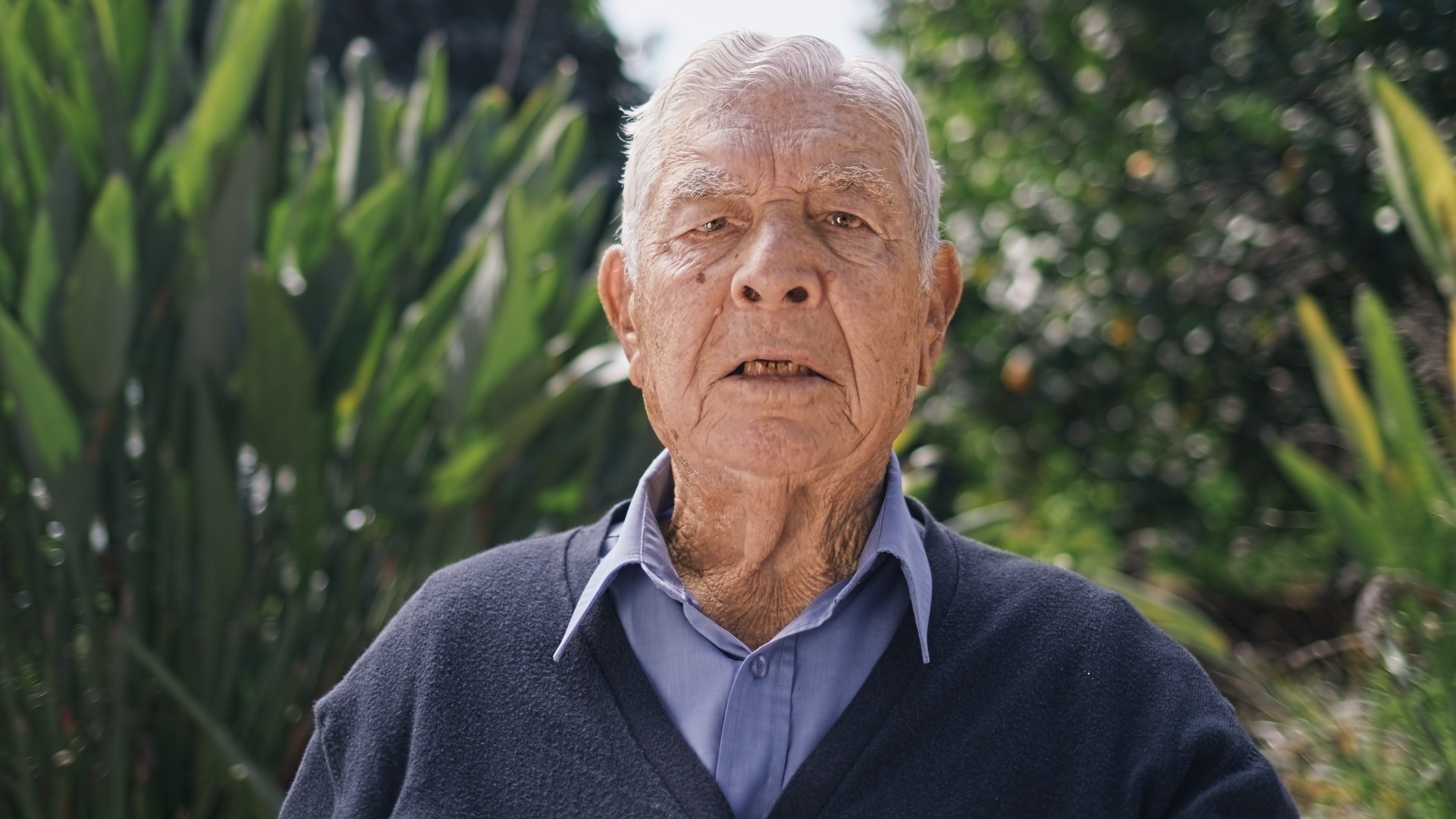 A farmer is remembering stories of the past while shooting an interview of him