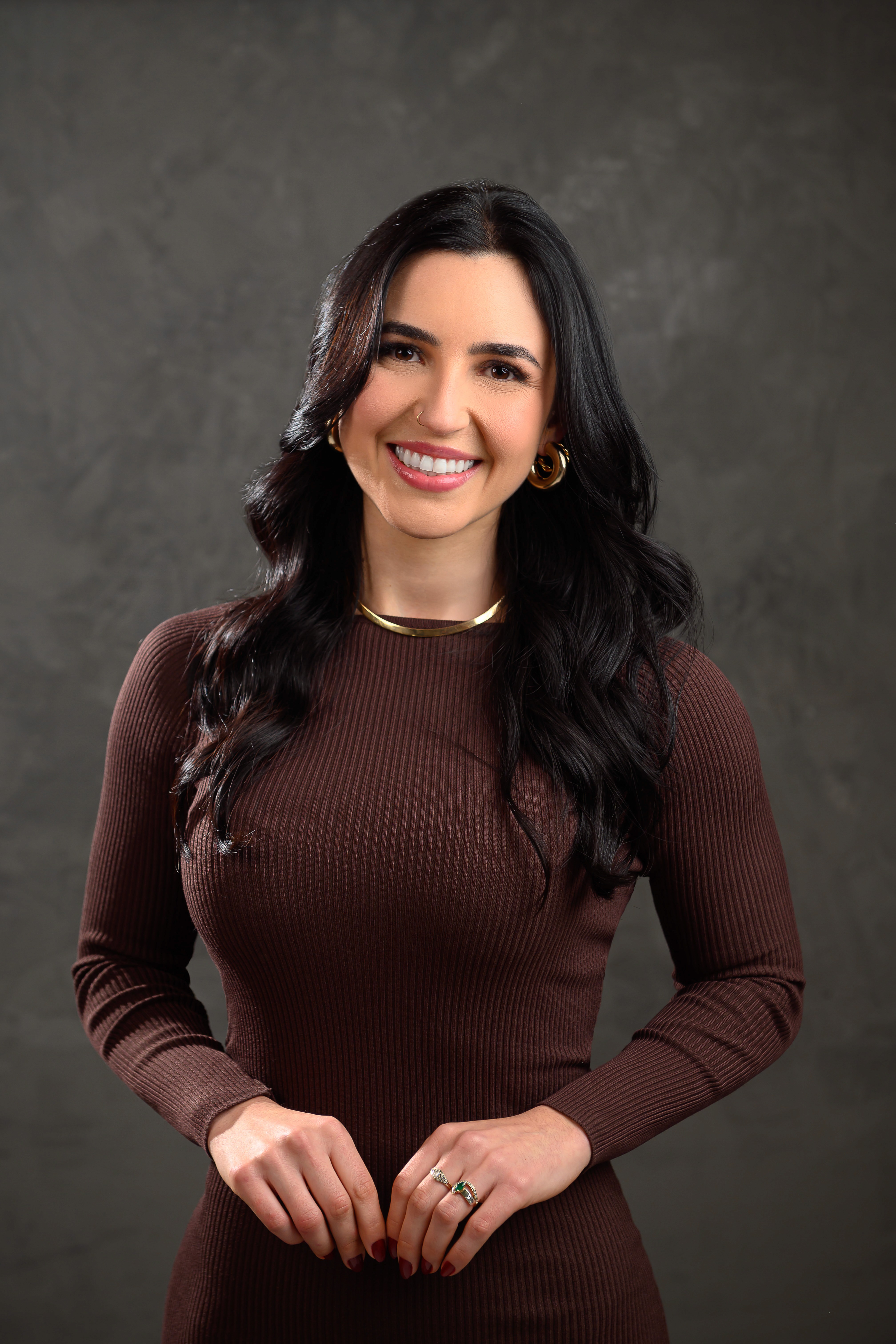 Rachel Stone, personal trainer and fitness coach, smiling in natural light