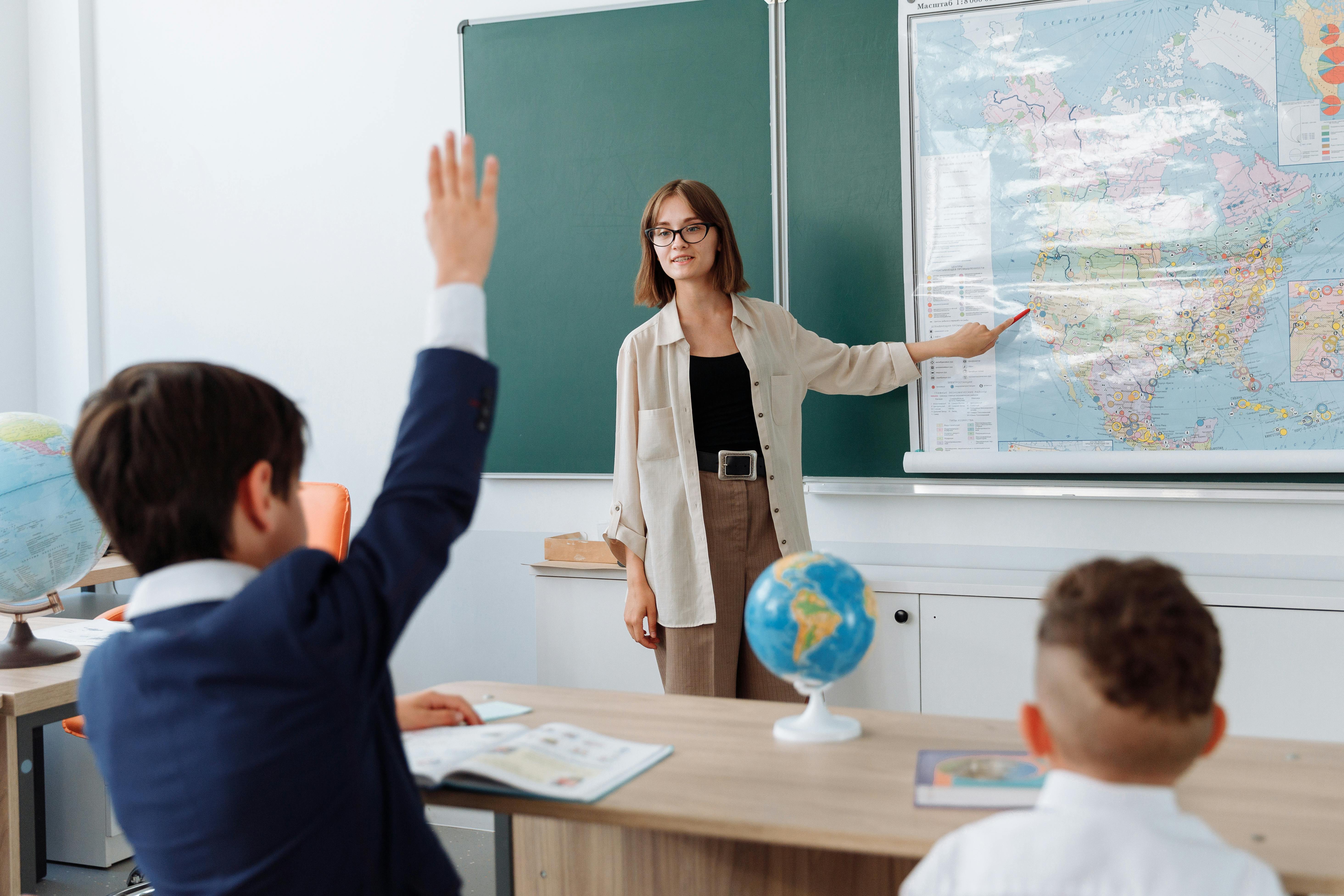 Foreign teacher giving a geography lesson in a Chinese classroom