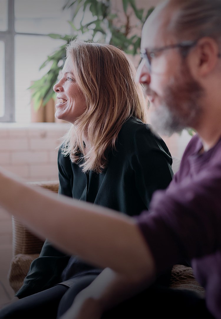 Thank you for getting in touch with Valliance header image of three of the team in discussion around their laptops