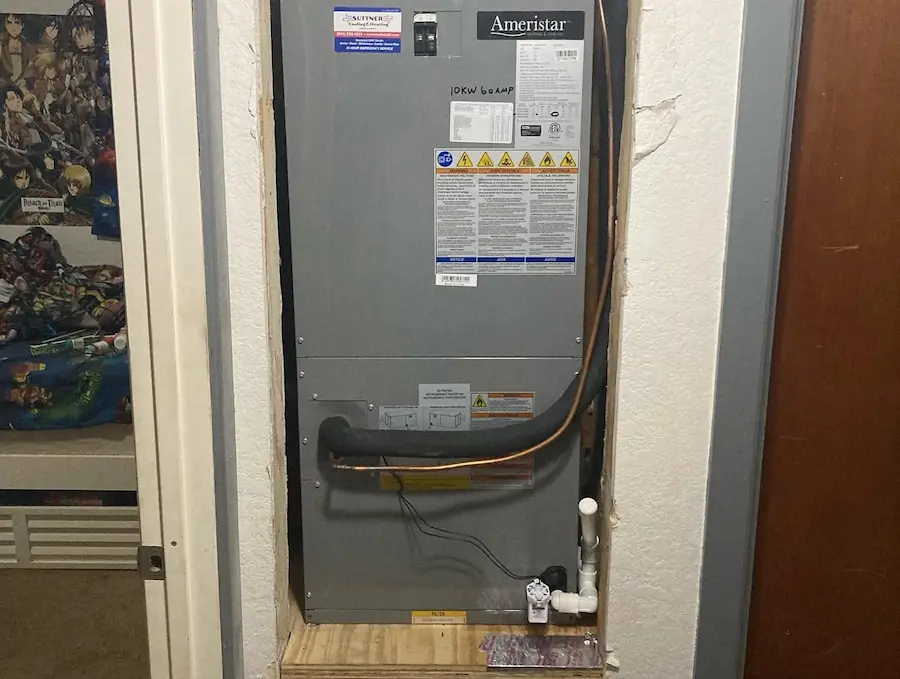 The image shows an Ameristar HVAC air conditioning system installed in a utility closet in Bradenton, FL, highlighting the unit typically serviced during AC repair.